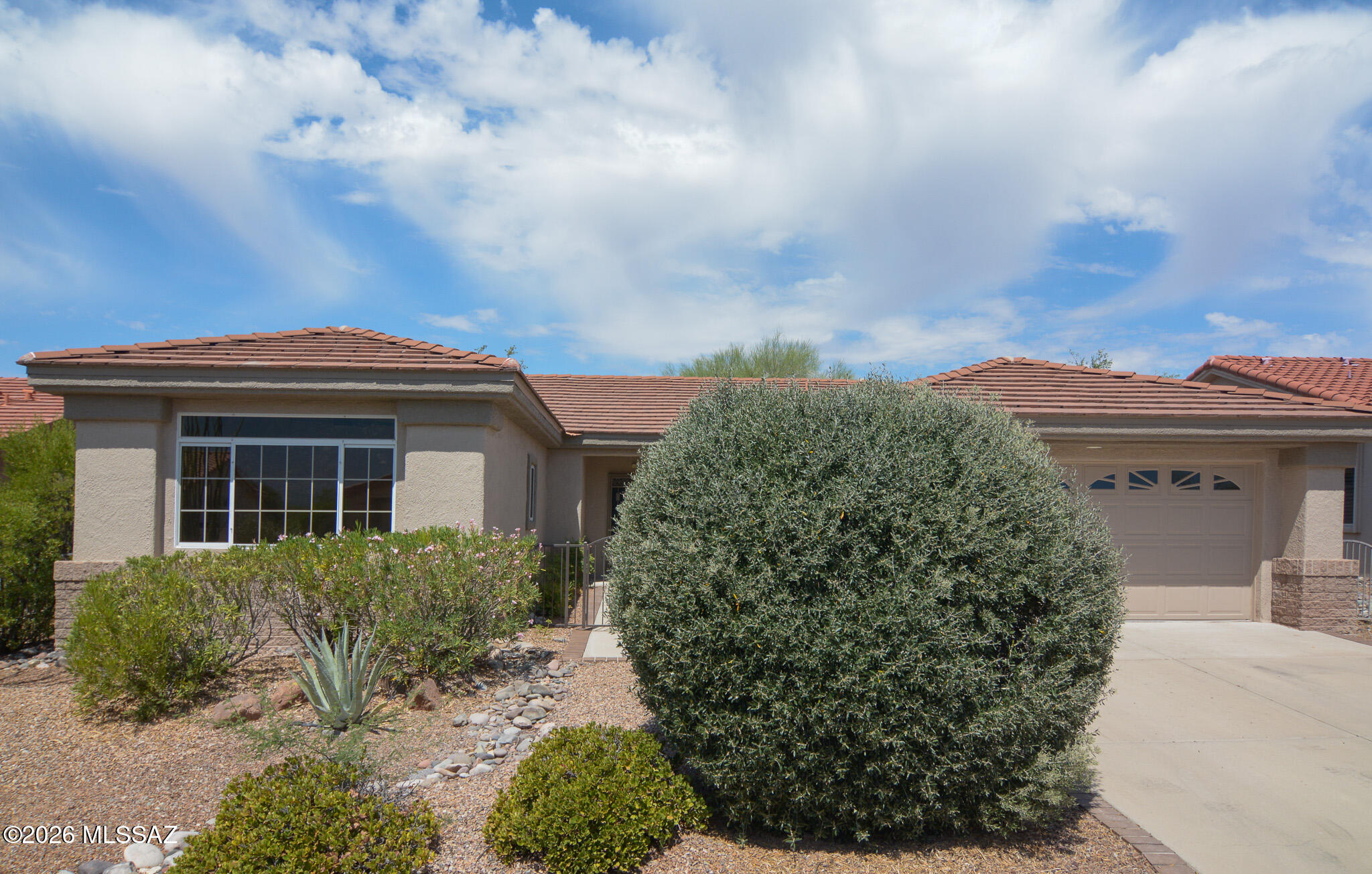 This stunning 3-bedroom, 2-bathroom residence is nestled in the 55+ community of Sun City Vistoso. Beautifully updated contemporary style home. Located in a desirable Oro Valley location. Earth tone ceramic tile flooring. Updated kitchen with stainless steel appliances and slate countertops. Spacious owner's suite with walk in closet. Updated bathrooms. Large covered porch. Desert vegetation. Two car garage with built in cabinets. Upgraded door hardware and light fixtures. Association amenities includes clubhouse, park, pickleball court, clubhouse, pool, spa/hot tub and tennis courts. This home shows beautifully.