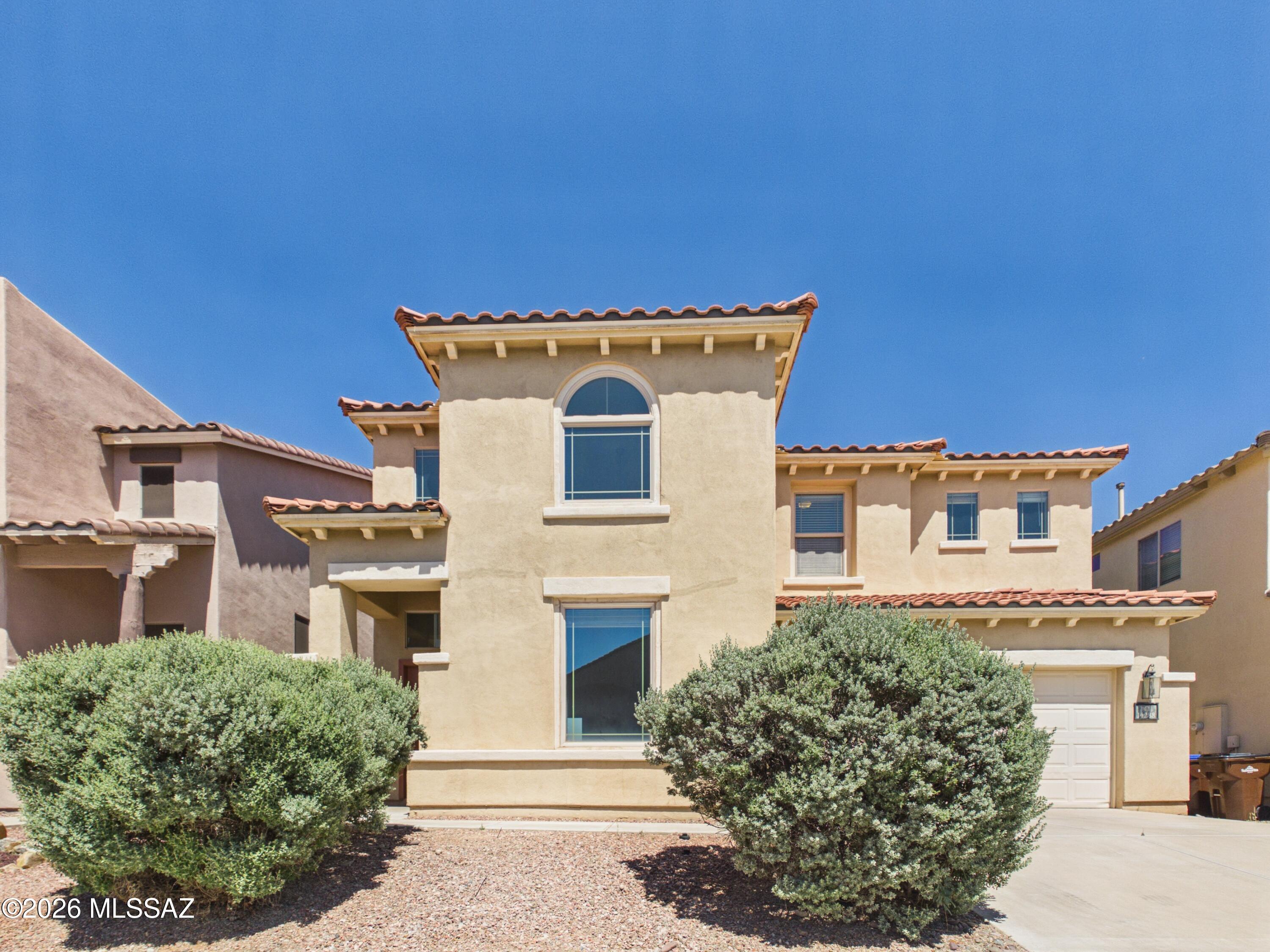 Located in the desirable Rancho Sahuarita community, this spacious 3-bedroom, 2.5-bath home offers nearly 2,000 sq ft of comfortable living space. Inside you'll find formal living and dining areas, an open kitchen with abundant cabinet storage, and a cozy family room with fireplace perfect for relaxing or entertaining. The generous primary suite features a walk-in closet and private bath. Enjoy a low-maintenance backyard, covered patio, and access to Rancho Sahuarita amenities including pools, parks, walking trails, fitness center, clubhouse, and more. Conveniently located near shopping, dining, and schools.