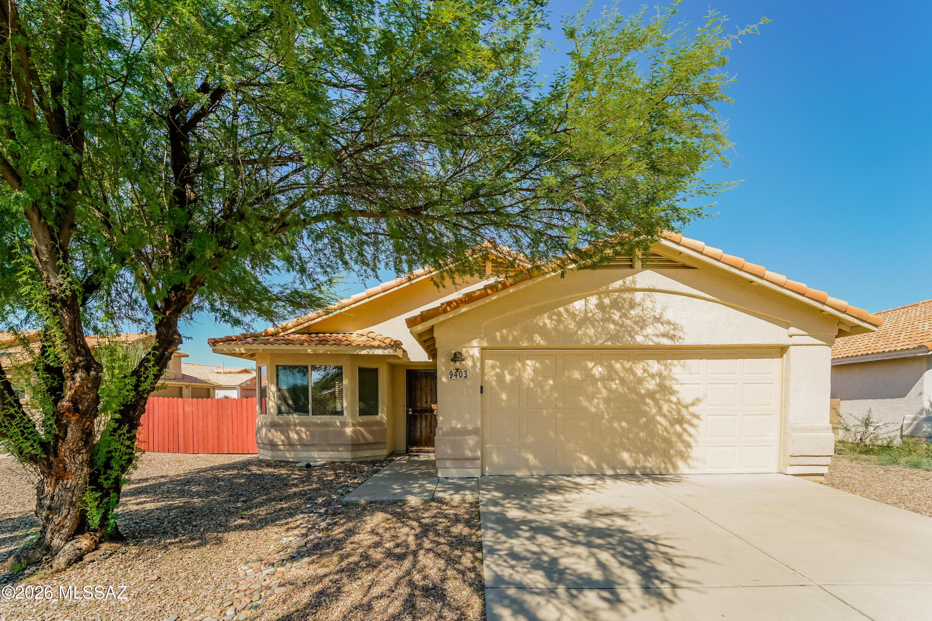 Welcome to this beautiful single-level, 3-bedroom, 2-bathroom home in the desirable Rita Ranch community! The spacious floor plan features neutral paint, tile throughout the main living areas, carpet in the bedrooms, & a cozy fireplace in the family room. The kitchen offers abundant cabinet, counter space, stainless steel appliances & a gas range. The spacious primary suite includes a private bathroom with double vanities & a walk-in closet. Outside, enjoy a large backyard featuring a paver walkway, Pebble surface pool & an RV gate. Best of all--there is no HOA!