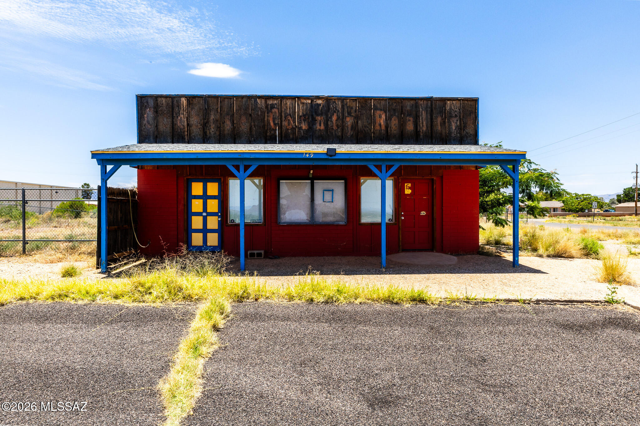 Prime commercial opportunity in the growing Sunizona/Pearce community! Located on a highly visible corner lot with highway frontage, this office/retail property offers excellent exposure and accessibility for a variety of business uses. Features include paved private parking, secure fenced outdoor storage for equipment, vehicles, and materials, plus room for future expansion. Inside, the building offers five private offices or work spaces, including two with separate exterior entrances, a restroom, and a break room. Ideal for professional offices, retail, contractor services, or investment purposes. A versatile property with great visibility and potential.