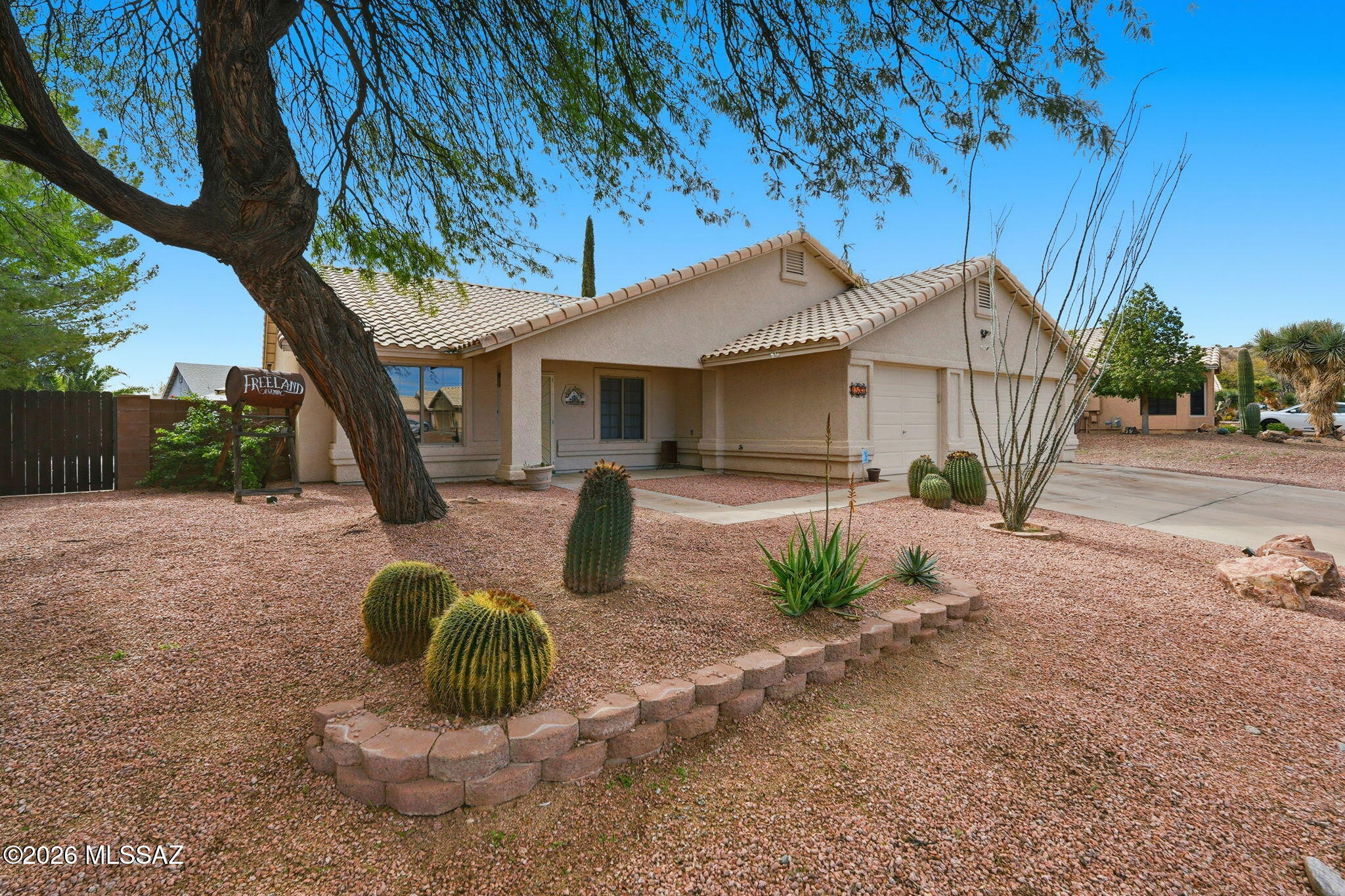 You will love this 4 bed/2 bath home located in a family friendly and quiet neighborhood. This move in ready home offers great living space inside and out. The back yard has a fully paved side yard with double gate entry, a tiki bar, covered porch and separate ramada for outdoor entertaining. The yard is surrounded by large trees and plants which provide great privacy and shade. The west side of the home has a separate gate which is great for a dog run. The inside of the home has great spaces for entertainment, vaulted ceilings, spacious bedrooms and living areas. The home has a brand-new roof, installed in 2024.  Remodeled primary bathroom, new lighting throughout the home, freshly painted interior walls, new carpet was installed in 2024. The kitchen cabinets have been refinished to include new hardware. The 3 car garage offers ample space for storage and workspace. Full home water filtration system. Great location, walking distance to Anamax park and quick access to stores and restaurants. This home won't last long, schedule your showing today! Owner/Agent