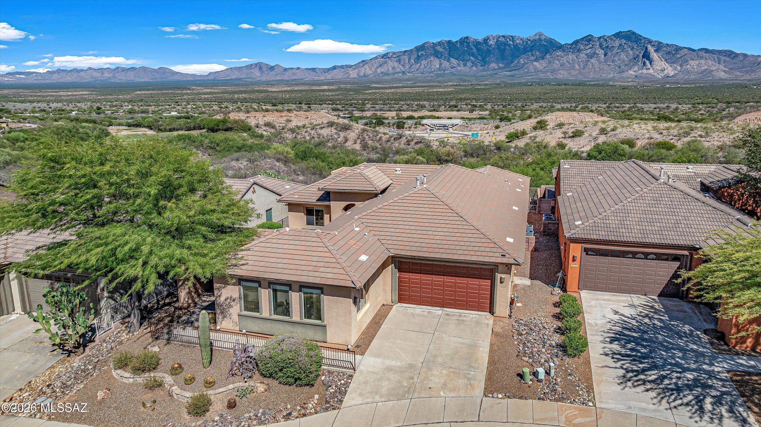Breathtaking, panoramic mountain views will elevate your appreciation of this spectacular home the moment you step inside. Stunning sunrises to greet the day and colorful sunsets reflecting on the Santa Rita Mountains like a priceless piece of fine art, all in your own backyard. This beautifully designed home features an open floor plan with spacious great room, formal dining area, kitchen with granite countertops, stainless appliances, and breakfast nook, all with mesmerizing picturesque views. The extended family/bonus room makes this the largest home in the subdivision. The guest casita welcomes family and friends with privacy, comfort and a separate entrance. You can also use it as a hobby room or office. Enjoy Green Valley to the fullest . . . See description click More Play world-class public and private golf courses. Canoa Ranch Golf Club is just outside your subdivision. As a member of the sought-after Green Valley Recreation community you can enjoy 22 different sites with fitness, tennis, pickleball, aquatics, and endless social and cultural events. Prime location near shopping, medical, dining, and I-19. Go to https://www.gvrec.org/ for more information.