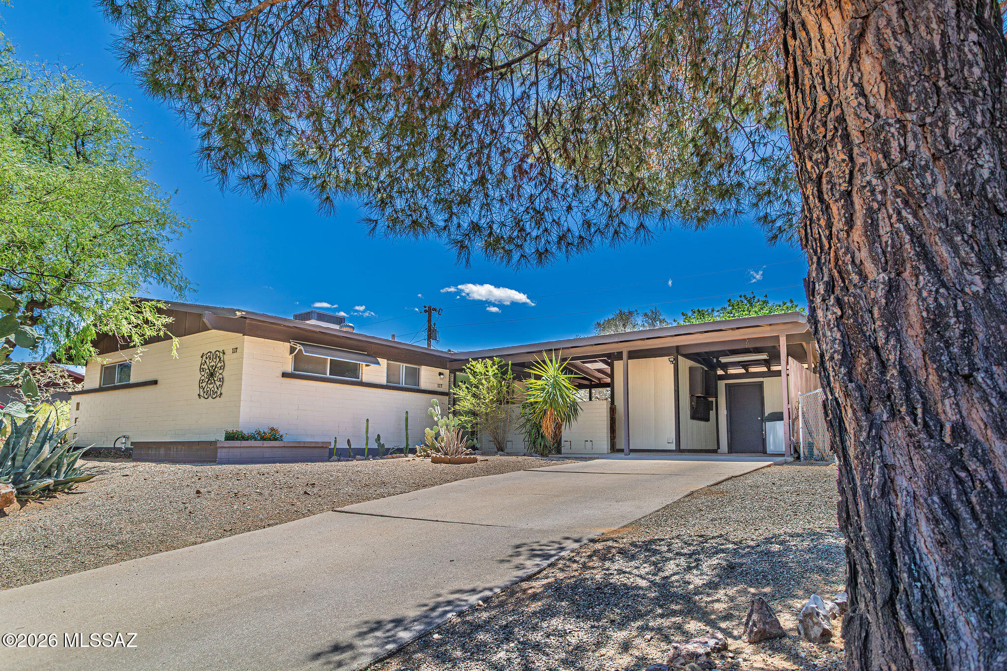 Charming home in this Incredible Corona de Tucson Community! No HOA and is situated on almost a Â¼ acre lot, features a double gate on the side of the house, a shed for storage off the carport, plus a large, detached storage shed in the backyard (newly painted)!  Pulling up the long driveway, you are greeted with a house that will make you feel like you are home!  Inviting, gated courtyard is off the kitchen and opens to the backyard. This property has multiple mature trees and vegetation along with raised flower beds, allowing for your dream flower or vegetable garden! Inside is freshly painted and features wood look plank flooring throughout with ceiling fans in bedrooms and the living room. The spacious living room is highlighted with custom built-in cabinetry and large windows allowing an abundance of natural light inside. The kitchen window overlooks the courtyard, it features a dishwasher, stainless steel refrigerator & double built in ovens and an electric cooktop; open shelving make this kitchen charming and functional! Updated bathroom shower has decorative tiled surround up to the ceiling, and newer brushed nickel shower faucet; it also features a decorative mirror and additional storage above the toilet.
Wonderful location not far from schools and only 10-15 minutes to trailheads, restaurants and shopping!