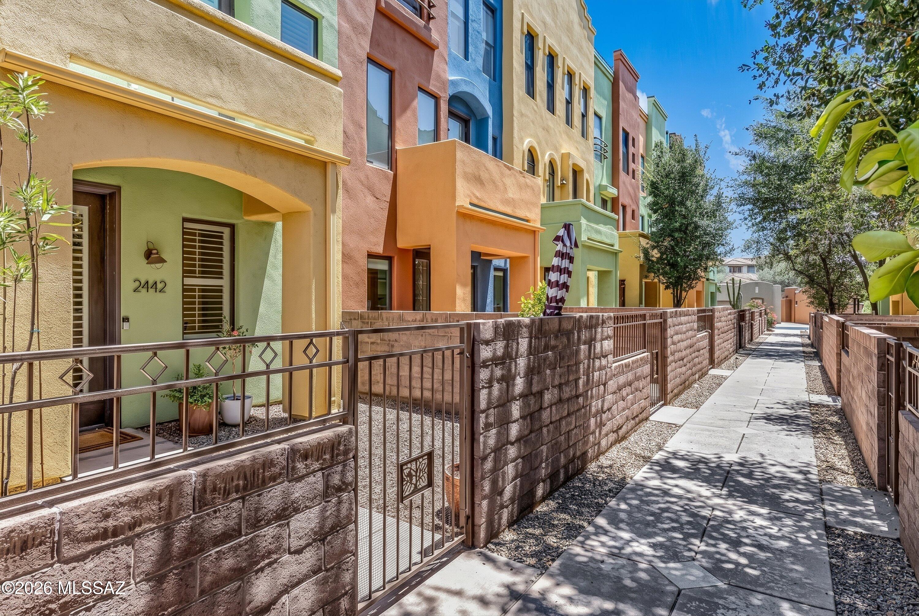 Tucked inside the sought-after gated community of River Walk in the Catalina Foothills, this 3-bedroom, 2.5-bath tri-level townhome w/elevator offers the kind of lifestyle that keeps people in Tucson forever. At 1,960 sf, there's room to breathe & space to entertain, all in one of the most coveted zip codes in Southern Arizona Home features an open kitchen w/granite counters, 42'' cabinets, breakfast bar, & stainless appliances. All bedrooms on the second level. Updated guest bathroom. The top floor loft opens to a rooftop deck with sweeping mountain views. Private courtyard w/low maintenance turf. Community pool, hot tub, & fitness center included. Easy access to Rillito Park, Trader Joe's, St. Philip's Plaza, & Tucson Racquet Club. The #1 bike path in America is just around the corner.