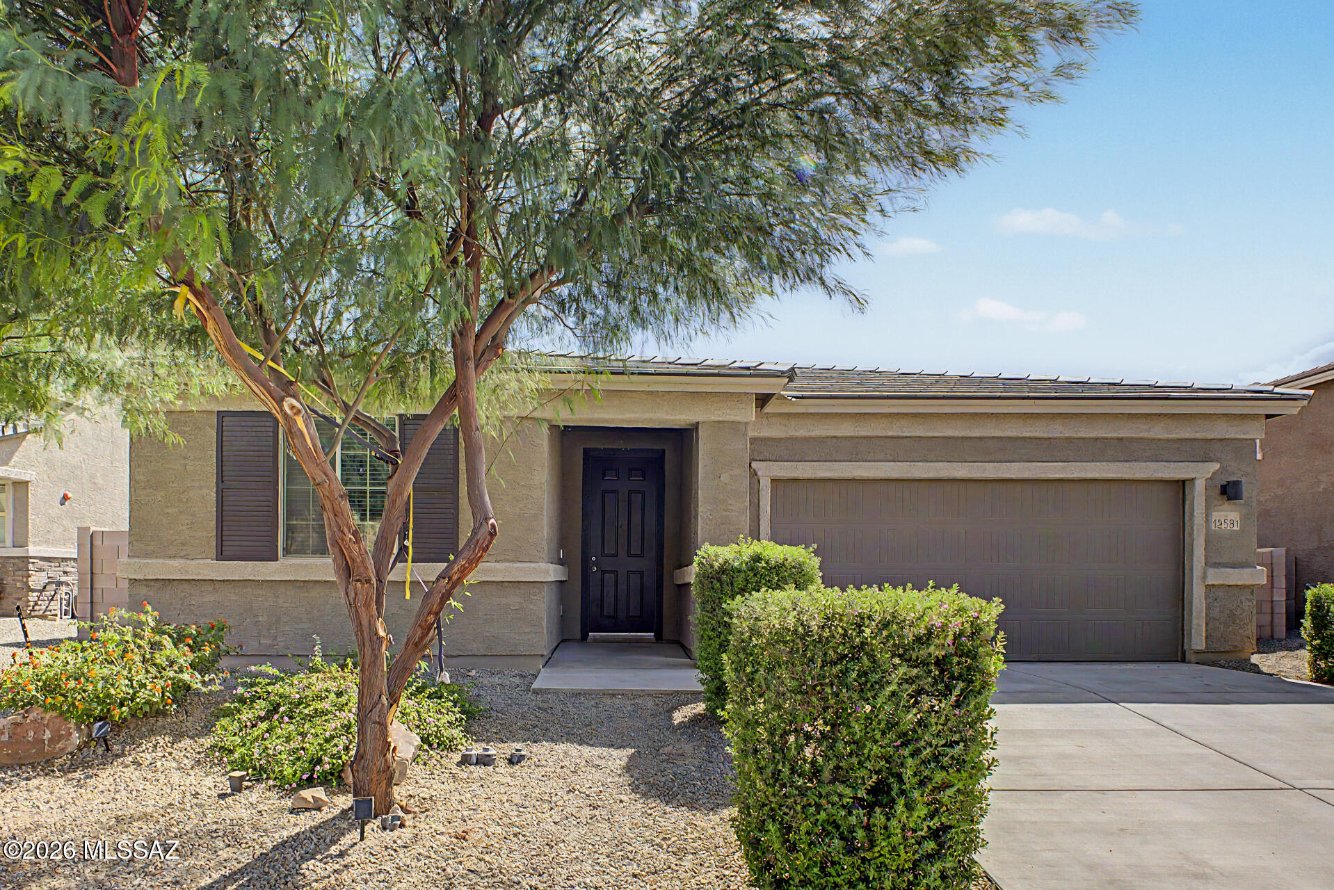 Welcome to this beautiful 4-bedroom, 3-bathroom home! This is a true Gladden Farms gem that needs to be seen in person to fully appreciate. Enter to see an open layout enhanced by tile flooring, neutral paint, and recessed lighting that fills the home with a bright, inviting atmosphere. It features a guest suite with its own full bathroom and walk in closet. At the heart of the home is a stylish kitchen featuring elegant pendant lighting, a classic subway tile backsplash, sleek gray cabinetry, built-in stainless steel appliances, granite counters, and a spacious walk-in pantry. Double doors lead to the serene main bedroom offering an ensuite complete with dual sinks, a glass-enclosed shower, and a generous walk-in closet. Discover a blank canvas backyard with a covered patio, ready for you to design your ideal outdoor oasis. You don't want to miss this fantastic residence!