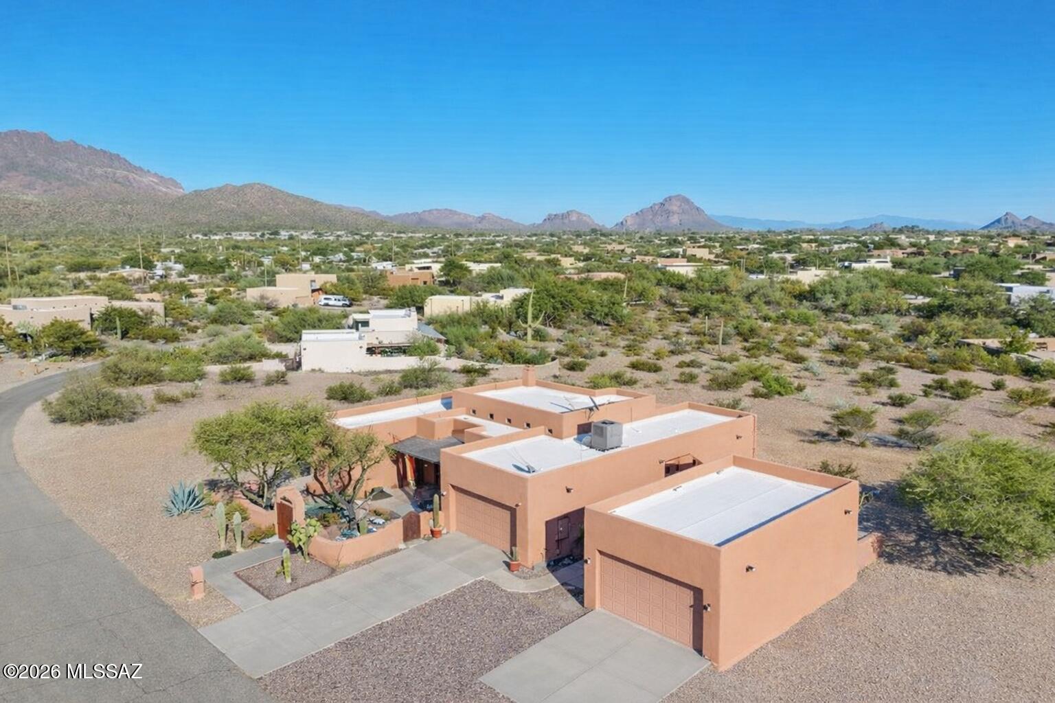 Back on the market! Buyers wanted Items were fixed! House Appraised! It is ready to be sold again!

Beyond the winding desert roads of Tucson, where the Sonoran sky stretches wide and the mountains blush at sunset, there waits a beautiful Santa Fe-style sanctuary. Peaceful 0.9-acre homesite, where freedom reigns with NO HOA. Also enjoy a newly installed HVAC system and Newly Coated Roof.

Inside, soft desert light spills across warm finishes, ceramic tile throughout (No Carpet) guiding you toward the heart of the home -- an inviting living space centered around a classic indoor beehive fireplace, where evenings feel softer and conversations linger longer.

3 Bedrooms, 2 Bathrooms + 2 Dens makes this home ideal for any family. Come take a look at this beautiful home! The kitchen is a gathering place by design spacious, welcoming, and filled with abundant light oak cabinetry and a generous breakfast bar, ready for morning coffee, shared meals, and the simple joys of everyday life.

With three spacious bedrooms, two baths, a dedicated office, and an additional flex room, this home offers space for both quiet moments and inspired living. The primary suite is a retreat of its own, featuring a beautifully tiled walk-in shower and the peaceful comfort of a space designed for rest and renewal.

An east-facing backyard keeps the afternoons cool and shaded, creating the perfect setting for long summer days. An extended covered patio overlooks your private oasis a sparkling pool and spa surrounded by resort-style landscaping. As twilight settles in, the outdoor beehive fireplace glows softly, turning ordinary evenings into something unforgettable.

For collectors, creators, and car enthusiasts, the property offers exceptional flexibility a 2-car garage plus a separate 2-car garage/workshop, with room for up to six vehicles depending on size.