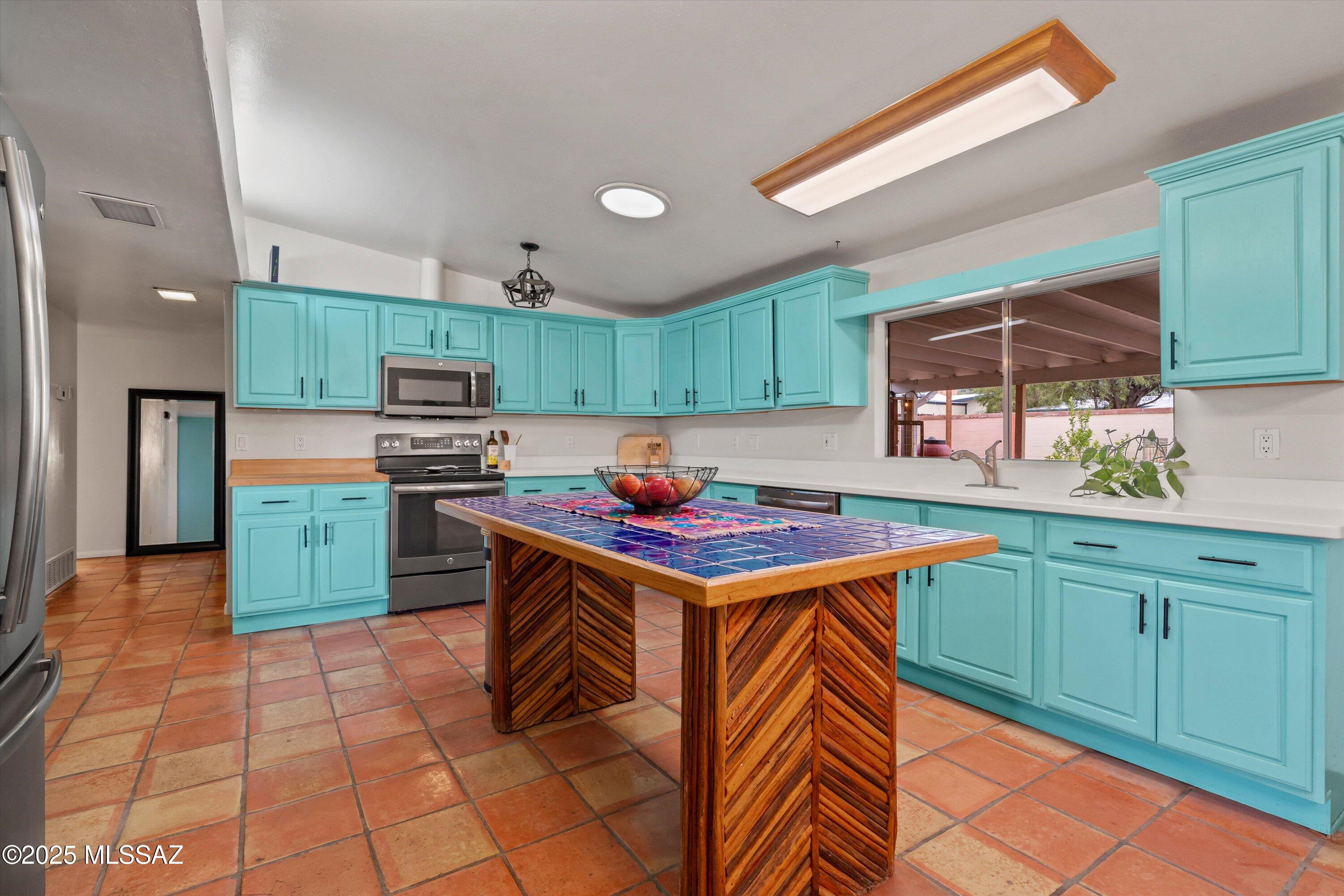 Discover timeless style and desert charm in this solid adobe-brick 3 bed, 2 bath home that beautifully blends mid-century modern design with classic Southwestern warmth. The bright and airy living room welcomes you with a picture window and cozy wood-burning fireplace. A spacious kitchen features upgraded appliances and ample storage, while the primary suite offers generous proportions and a walk-in closet. Enjoy the outdoors year-round with low-maintenance front landscaping and a serene backyard —complete with a large covered patio, raised garden beds, and a two-person barrel sauna. Nestled on a quiet cul-de-sac with desirable north-south orientation, just minutes from local dining, shopping, and Palo Verde Park with its community pool. Don't miss this opportunity to own a truly special home that invites comfort, style, and relaxation inside and out.