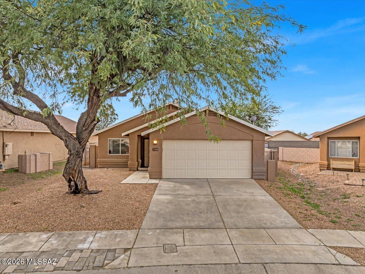 Refreshed home in popular Rita Ranch area no polybutylene pipes here, updated shower in primary, freshly painted with new light fixtures fans and door knobs throughout the home even new toilets cool bonus room could be office kid cave or temperature controlled storage, two giant mesquite trees that have been well cared for over the years provide shade in the front yard as well as in the back, raised garden bed for your next Harvest or pretty annuals. Home recently painted