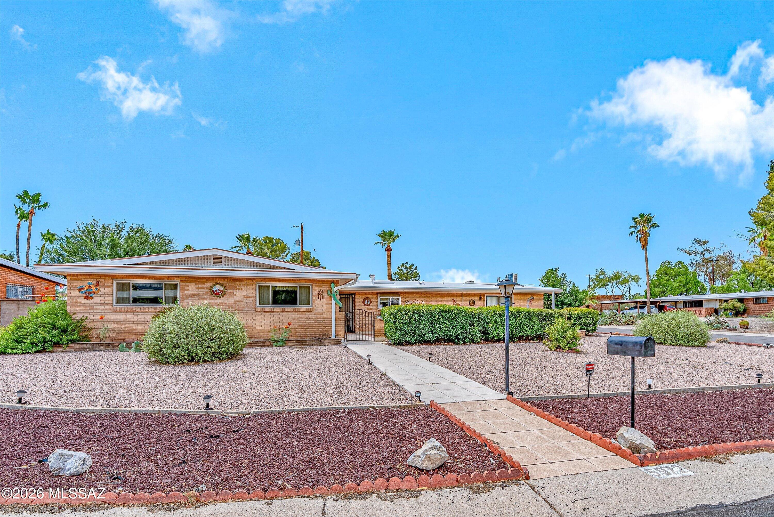 Charming brick home with incredible flexibility! The main residence offers 3 bedrooms, 2 bathrooms and newer windows. This home sits behind spacious courtyard ideal for morning coffee. What sets this property apart is the fully self-contained guest quarters that is complete with its own private entrance, one bedroom, living room, full kitchen, and two mini-split units for year-round comfort. Perfect as a mother-in-law suite, home office, or an income producing rental. All of this in a prime location just minutes from shopping and dining. Don't miss this one!