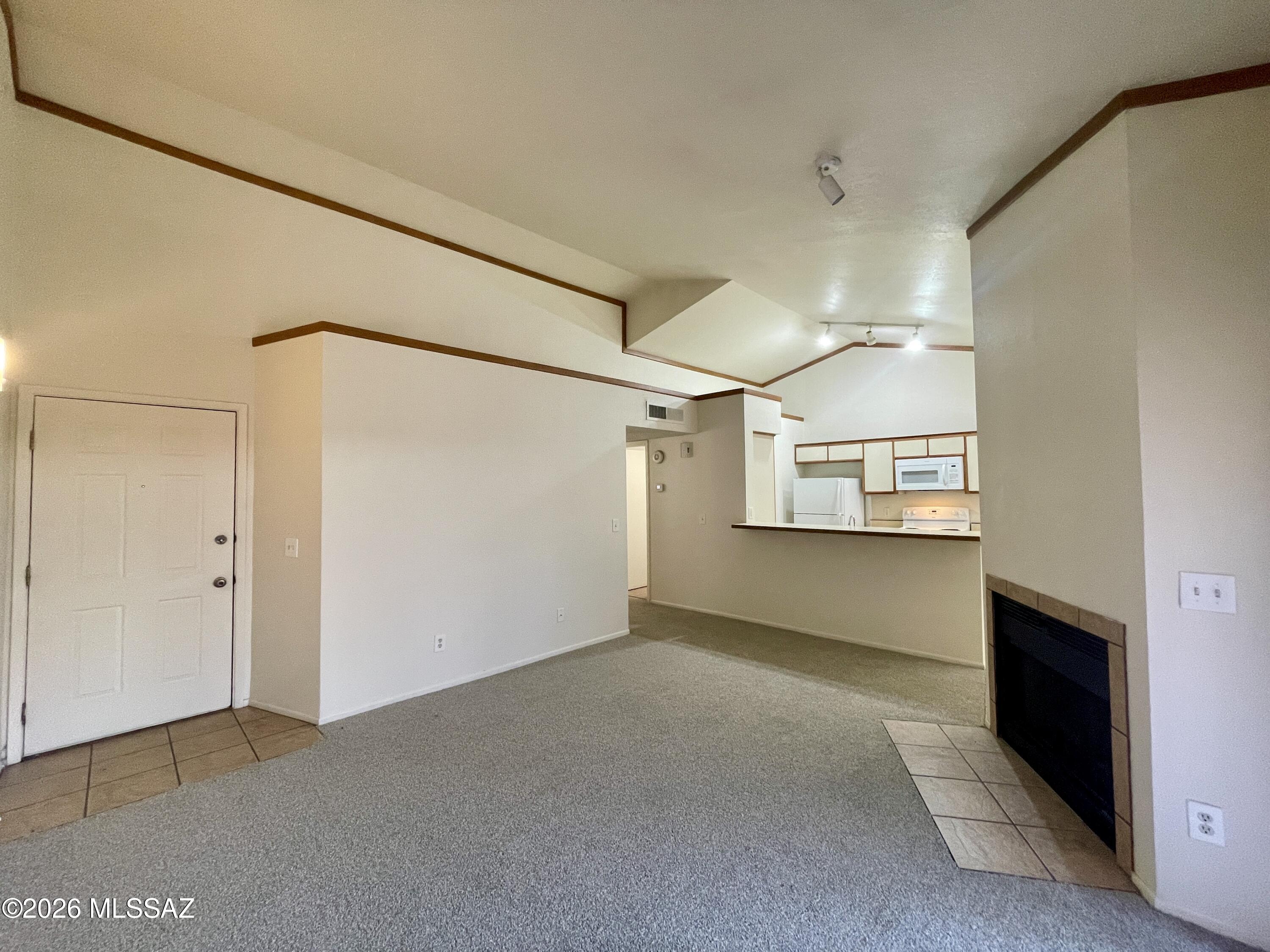 Call to schedule a tour of this spacious second-story  two-bedroom, two-bathroom home with high ceilings, included appliances, and large balcony! Minutes from Tucson Spectrum, dining, entertainment, and I-19 and I-10.