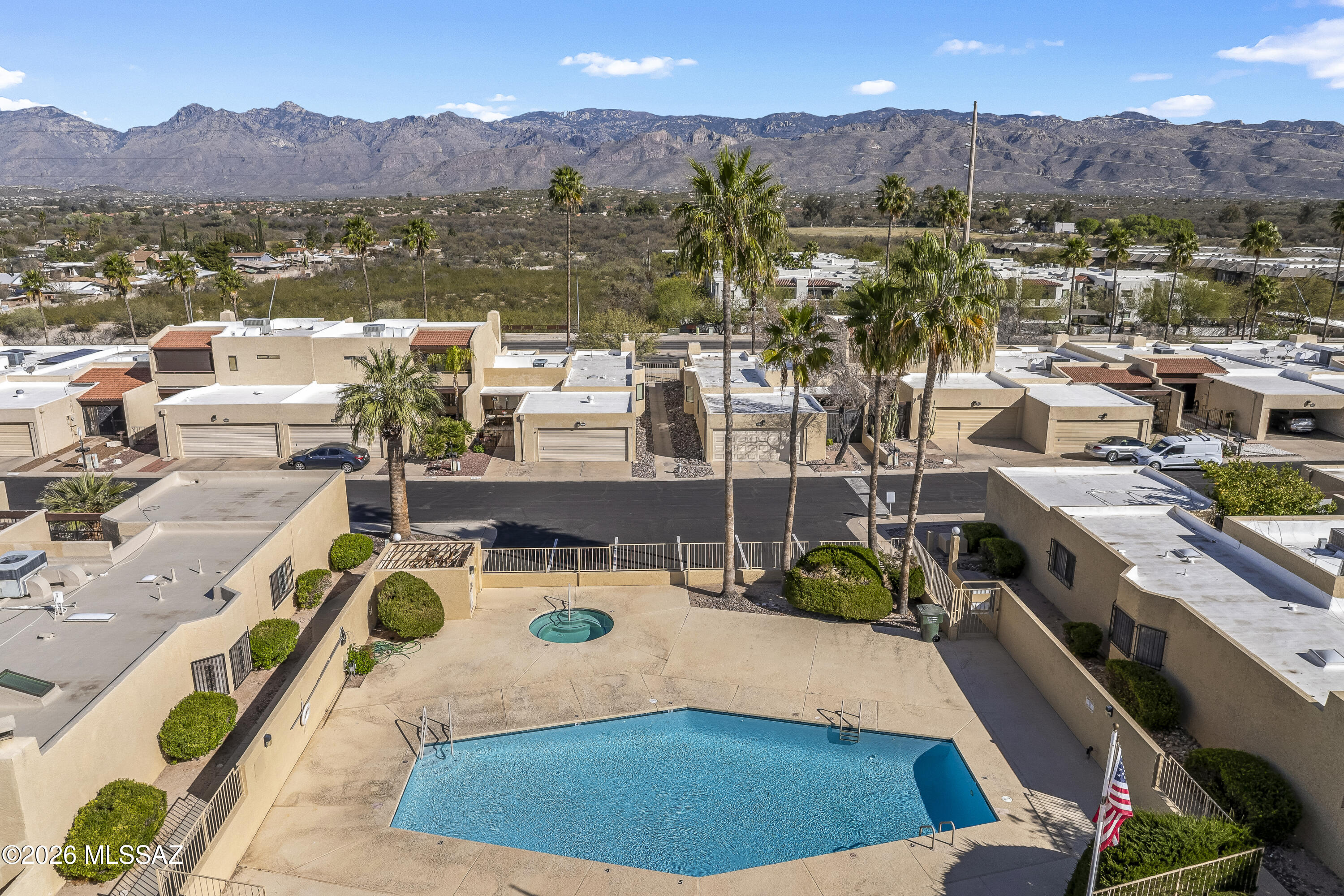 Move-in ready, nicely updated townhome.  Recently painted inside & out.  Two car garage.  Large downstairs bedroom with on-suite bathroom, walk in closet & covered patio.  Well thought out layout with welcoming entrance, kiva fireplace.  Generous kitchen with plenty of cabinets and counter space. New flooring throughout except hallway.  Large patio with two fruit trees & flowers plus two balconies.  Separate guest powder room downstairs  Two large bedrooms and second full bathroom upstairs.  Car-length plus driveway.  Nearby community pool, spa & clubhouse.  HOA fees cover water, sewer, pool, spa and common area maintenance.