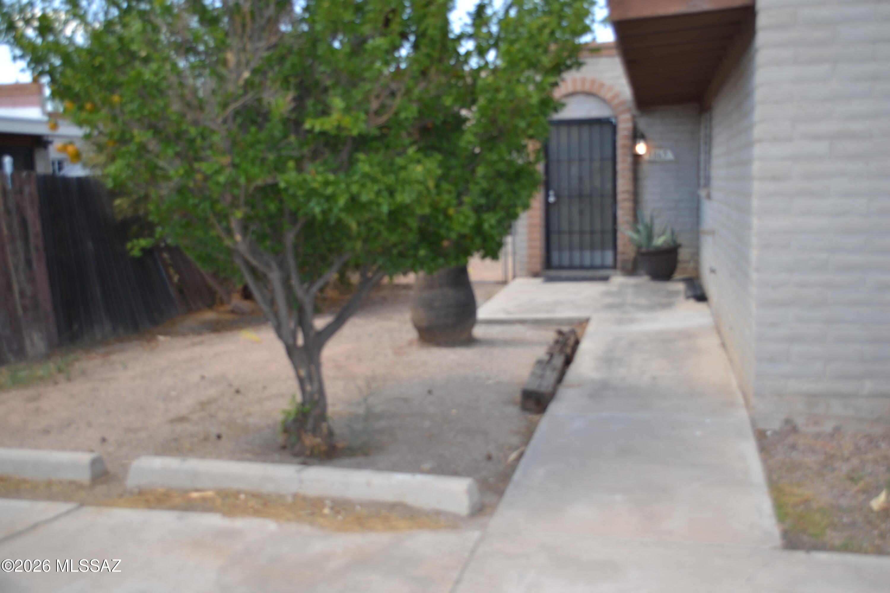 Quaint 2 bedroom l.5 baths home, living room, open kitchen, a/c,  large enclosed backyard, washer hook up, 2 car parking