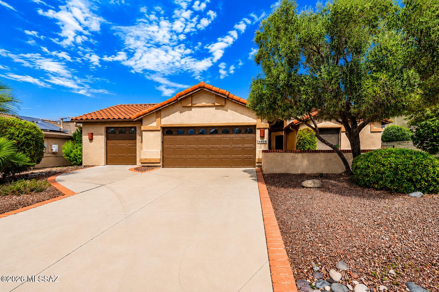 Welcome to this beautifully maintained home in Quail Creek! This property qualifies for USDA financing with $0 down for eligible buyers. Featuring a desirable 3-car garage with an additional bay perfect for a golf cart or extra storage, complete with a dedicated window A/C unit. Enjoy the inviting paver courtyard and a spacious backyard patio with an authentic adobe fireplace, mature landscaping, and producing citrus trees. Inside, the open-concept floor plan offers a large kitchen with an oversized island, abundant cabinetry, a built-in desk, and seamless flow into the living and outdoor spaces, making it ideal for entertaining or everyday living.