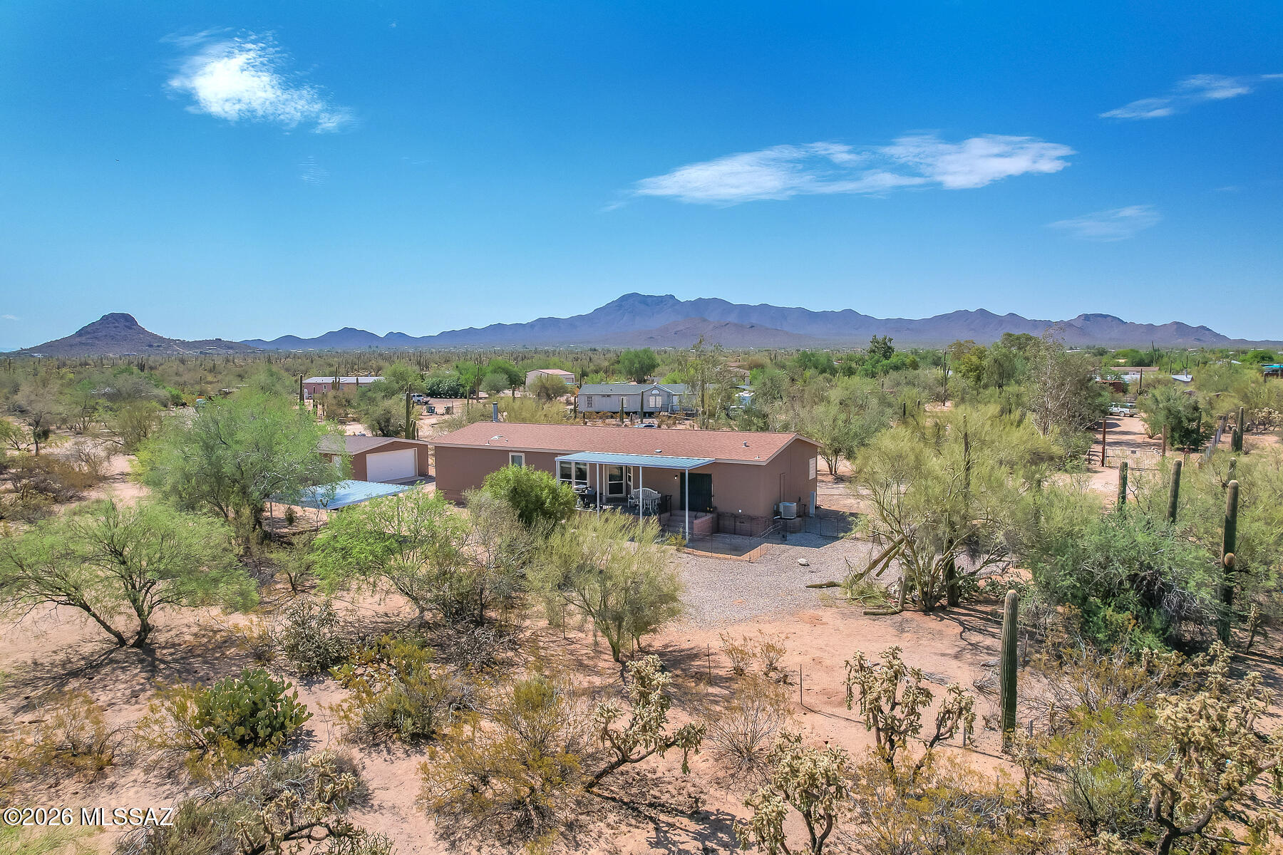 Enjoy the best of Country living on a 1+ acre lot with privacy, space & mountain views. This spacious home features 3 bd, 2.5 baths, an inviting living room with a cozy corner fireplace, plus a versatile den-bonus room perfect for office or guest space. And a family room off the kitchen. The functional kitchen offers an island, breakfast bar, ample storage & workspace for everyday living & entertaining. Outside you'll find a detached large garage, carport and storage shed with plenty of room for toys, hobbies or future projects.  Relax on the back patio & enjoy the amazing mountain views while enjoying the peaceful surroundings.