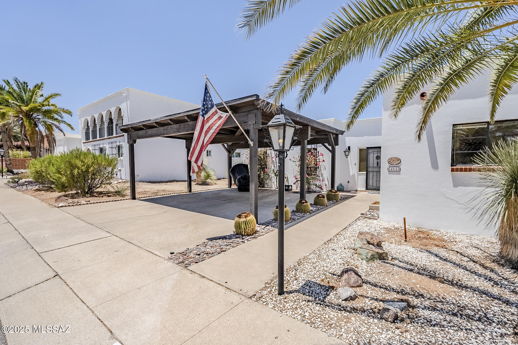 This quaint southwestern townhome has been styled and color coordinated to perfection while keeping it's rustic charm. From the new wood-look ceramic tile flooring to the updated kitchen boasting granite countertops, matching backsplash, new SS appliances, a gas range, sink & faucet and a front viewing window.  AZ Room and rear yard offer a northern exposure for cooler days & nights relaxing outback. New 200 amp electrical service, double carport and storage. Close in, walk, bike, golf cart to shops, bus line, restaurants, entertainment, farmers market and fiestas! Active Adult Living starts here! NO GV Rec, remains available.
