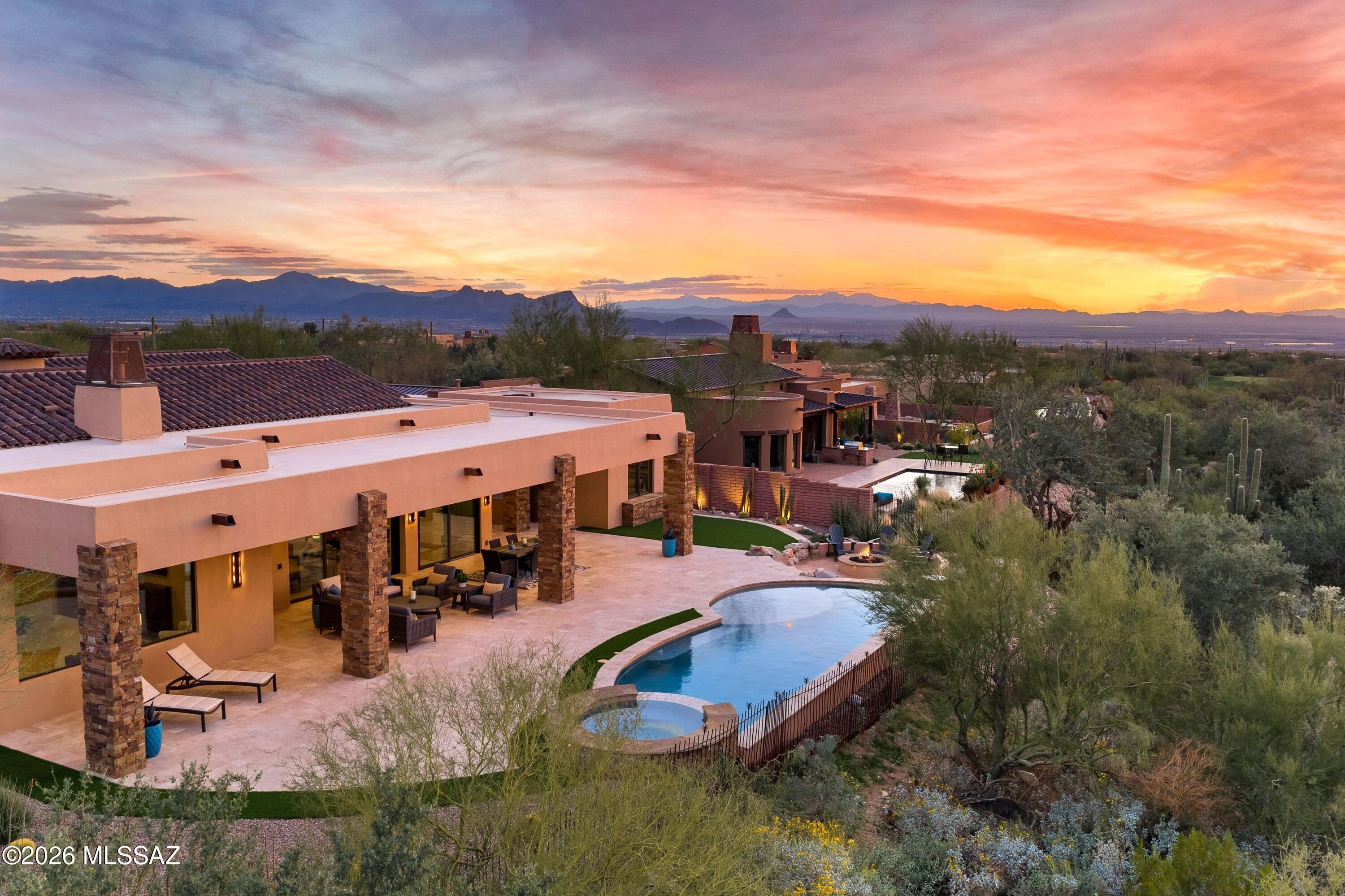Set on one of the most captivating homesites within The Ritz-Carlton Residences, Dove Mountain, this stunning property offers sweeping golf course, mountain and sunset views that define the essence of elevated Sonoran living. 

The main residence offers three beautifully appointed bedroom suites, each with its own ensuite bath, along with a dedicated den ideal for a private office or media retreat. A separate guest casita provides an inviting haven for visitors, ensuring both privacy & comfort. Designed for refined living and effortless entertaining, expansive walls of glass frame the stunning natural surroundings, seamlessly blending indoor & outdoor spaces. 

The chef's kitchen is appointed with Wolf & Sub-Zero appliances, striking finishes, and generous prep and gathering space, opening beautifully to the great room & outdoor living areas. A Southwest contemporary aesthetic creates warmth & architectural interest while maintaining a clean, versatile design that complements a range of personal styles.

The outdoor setting is nothing short of exceptional. Overlooking the lush fairways and dramatic Tortolita Mountains, the backyard retreat features a sparkling pool and spa, expansive patio space, and a fire feature perfectly positioned for unforgettable Arizona sunsets.

With its flexible floor plan, private casita for guests, and truly breathtaking views, this residence captures the rare combination of luxury, privacy, and timeless desert elegance within the gates of The Ritz-Carlton Residences, Dove Mountain.

Homeowners enjoy access to resort amenities, concierge services, a variety of fitness facilities & classes, social events and more. Owners enjoy membership at The Golf Club at Dove Mountain. Welcome Home!