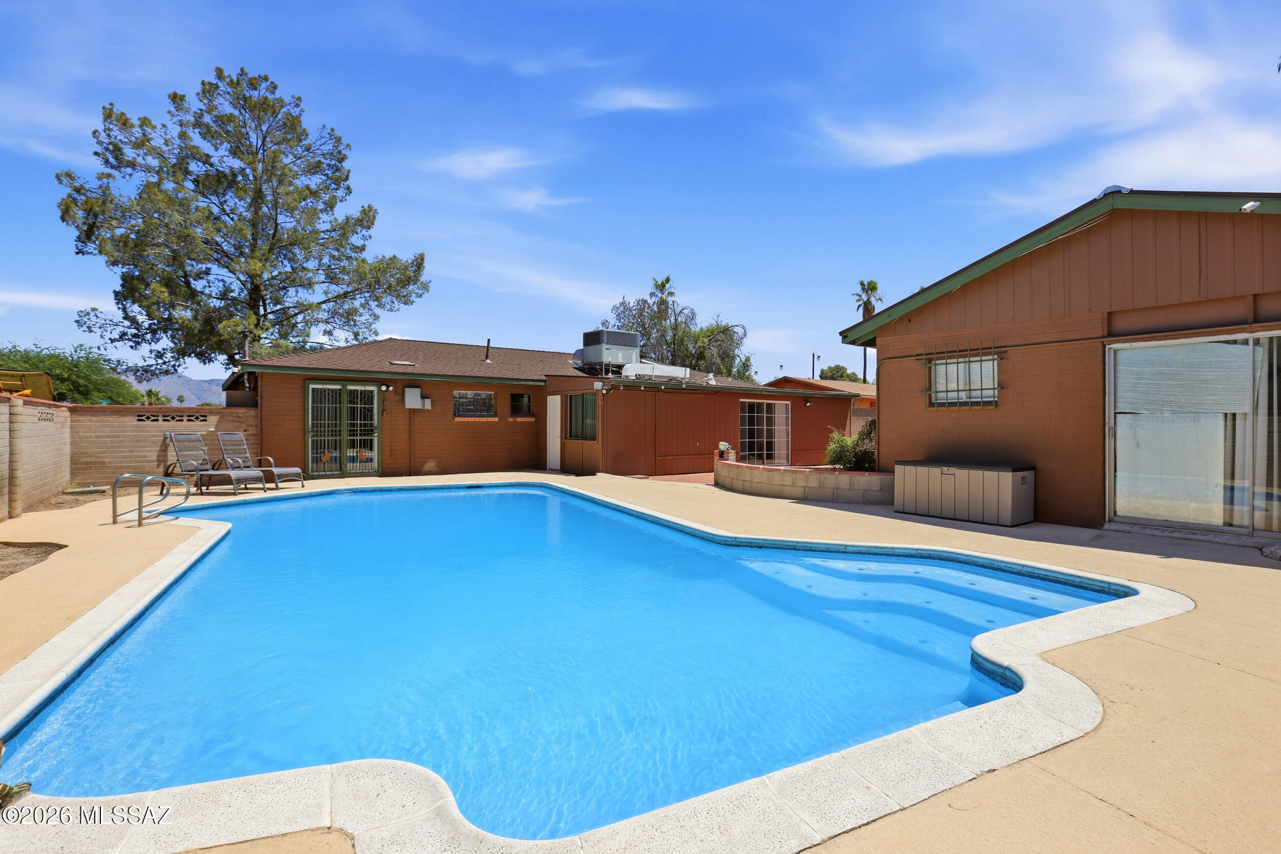 Discover the space and flexibility you've been searching for! This inviting Tucson property features a 30,000-gallon sparkling pool, a detached 2-bedroom guest house complete with a full kitchen and bath, and a workshop ready for hobbies, projects, or extra storage. Inside, you'll find a spacious primary suite, granite countertops, and stainless steel appliances. Step outside to a large paved patio designed for entertaining, a dog run, and plenty of room to create your dream garden or desert retreat. Enjoy beautiful mountain views from the property while being just minutes from shopping, dining, and everyday conveniences. Whether you're looking for multi-generational living, guest accommodations, or extra space to fit your lifestyle, this property offers endless possibilities.