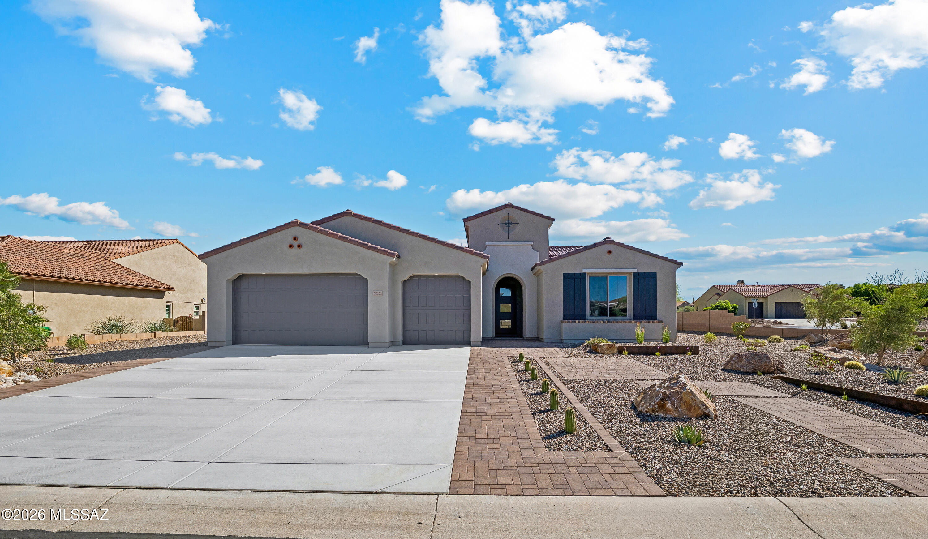 Experience elevated desert living in this beautifully appointed home, where luxury finishes and designer details create an atmosphere of sophistication and comfort. At the heart of the home is a stunning chef-inspired kitchen featuring the premium Preserve Series built-in stainless steel appliance package, including a combo wall oven with Speed Cook & Steam technology, pro-style wall hood, top-control dishwasher, cooktop, and an impressive 42'' built-in Signature Kitchen Suite refrigerator. Elegant Madison Beechwood cabinetry with 42'' uppers and 2'' shaker crown moulding adds warmth and timeless style, while quartz countertops with a full-height backsplash provide a sleek, modern finish. Completing the space are a striking Kohler Cairn sink in Matte White with sink rack. The spa-like bathrooms continue the upscale aesthetic with quartz countertops, Kohler sinks, framed mirrors, and stylish Delta Saylor fixtures and accessories in chrome. The powder room features a classic Kohler pedestal sink, adding an elegant touch for guests.

Thoughtfully upgraded throughout, the home also includes a desirable 2' extension at the Primary Suite and walk-in closet, creating a more spacious and relaxing retreat. Upgraded carpet, tile, and engineered wood/LVP flooring add texture and sophistication throughout the interior, while the laundry room is enhanced with quartz countertops for added functionality and style. Contemporary 5" baseboards and professionally designed landscaping complete this exceptional home, blending modern luxury with everyday livability.