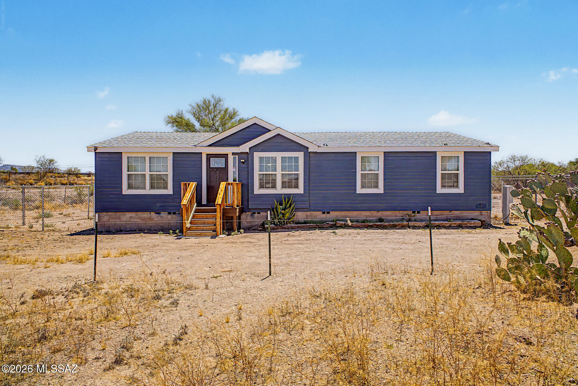 Fantastic opportunity to own this tastefully updated manufactured home on a huge 1-acre lot with horse privileges! The inviting interior features tons of natural light, vaulted ceilings, neutral palette, and wood-look flooring t/out. Functional floor plan showcasing a large living room and a bright family room w/French doors to the back. The kitchen boasts SS appliances & ample wood cabinets. Main bedroom has a walk-in closet & a full bathroom w/dual sinks. Check out the backyard's fenced-in area, offering an elevated deck & a storage shed! Beyond the fence is an expansive area for horses, recreational use, or endless possibilities. Plenty of room for parking! Enjoy the mountain views! With easy access to the I-10, this gem provides the ideal blend of rural charm & accessibility. Just WOW!
