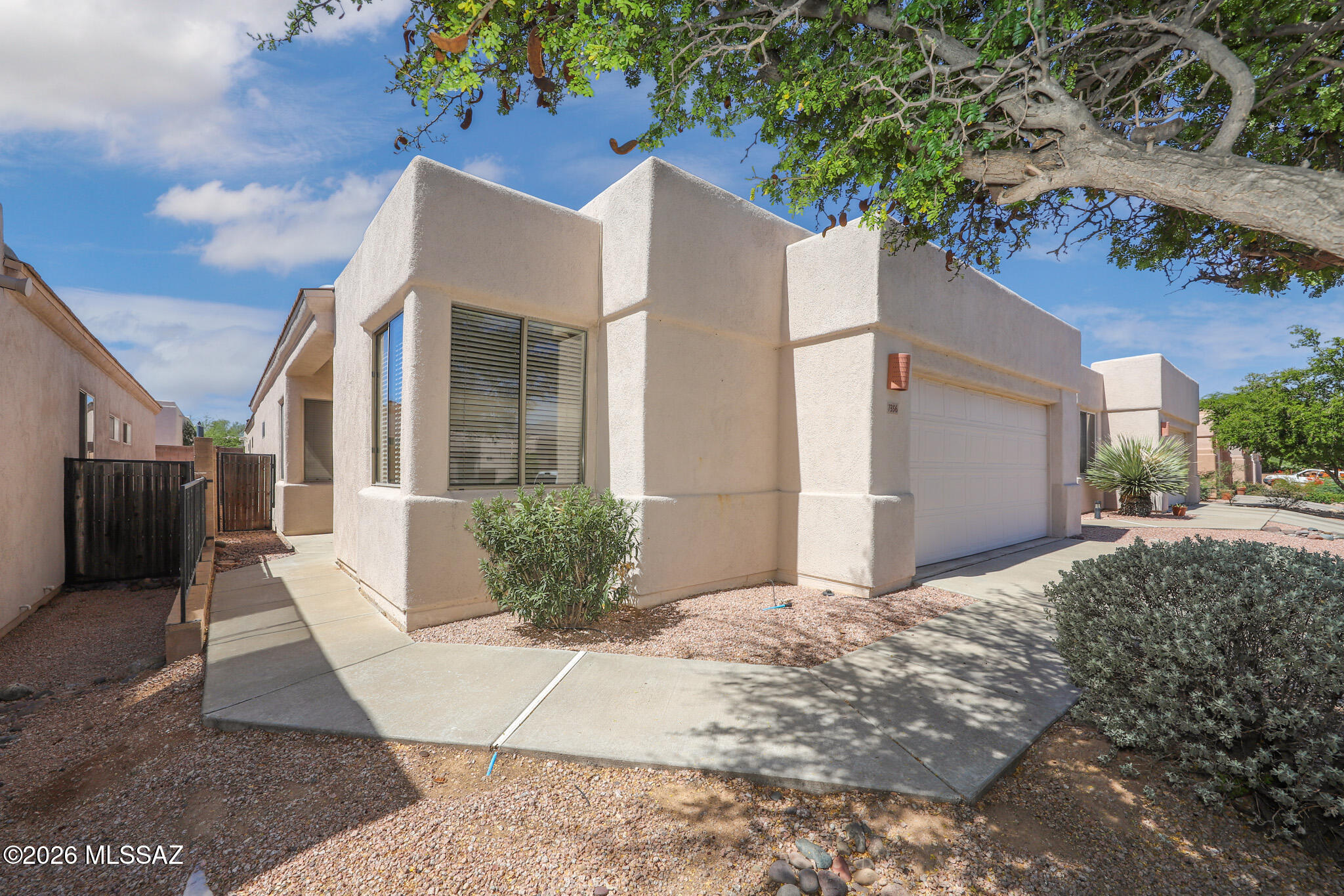 Enjoy resort-style living in the sought-after gated Rancho Esperero community in Northeast Tucson! This inviting home features tile flooring throughout the main living and wet areas, ceiling fans throughout, and a cozy gas fireplace. The primary suite includes a private in-suite bath with a double vanity. All appliances are included, including a washer and dryer. Community amenities feature three sparkling pools(one is heated during the winter), while nearby Udall Park, restaurants, shopping, located in Sabino H.S. boundaries and everyday conveniences make this an ideal place to call home.