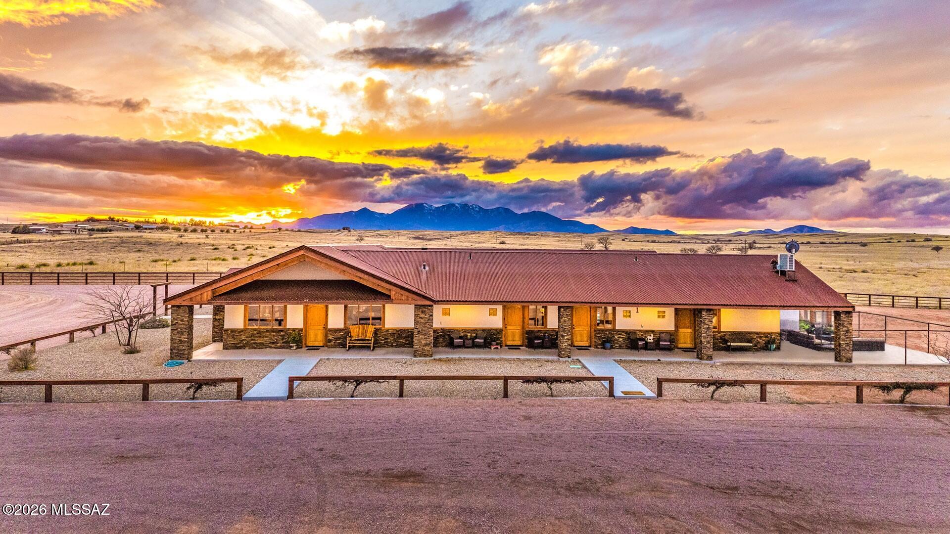 Seize Your Opportunity at a Modern Horse Ranch. This exceptional property offers nearly 40 acres of country living with every amenity already in place. The solid steel-framed residence spans over 5,550 sq. ft. with soaring ceilings and a spacious open great room. The private west-wing primary suite is thoughtfully separated from the east-wing guest bedrooms, providing comfort and privacy for all. Highlights include: 4 bedrooms, 5 baths, attached 1,000 sq. ft. greenhouse, enclosed courtyard with pool, 40' x 100' barn (with open-air roofed stables on both north and south perimeters),heavy-duty steel fencing enclosing the 5-acre home site, stables, pens, and 20' x 100' bull ring. A well with a 14,000-gallon storage tank, supported by both solar and grid power.