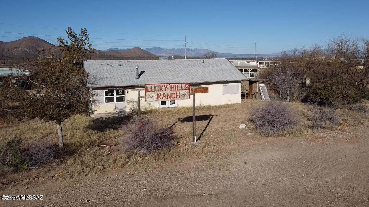 Have you ever dreamt of owning a 700 acre Dude Ranch in Tombstone Arizona? Maybe a short term rental compound with horse facilities and a shooting range? Maybe you would like to provide trail rides in the ''Town Too Tough to Die''?...Say no more. Lucky Hills Ranch is situated a short distance from the historic Allen St. attractions like the OK Corral, Birdcage theater and Historic Tombstone Courthouse and all of the fun of the old west. This ranch was alleged to have been once owned by Fred Rai, the German Roy Rogers for many years. It has a total of seven houses that were built in 1994 and one common house which dates back to the 1930's. This property has many features of interest as it sits along Allen st and the washes nearby. This property is on Tombstone City water and has multiple septic tanks.