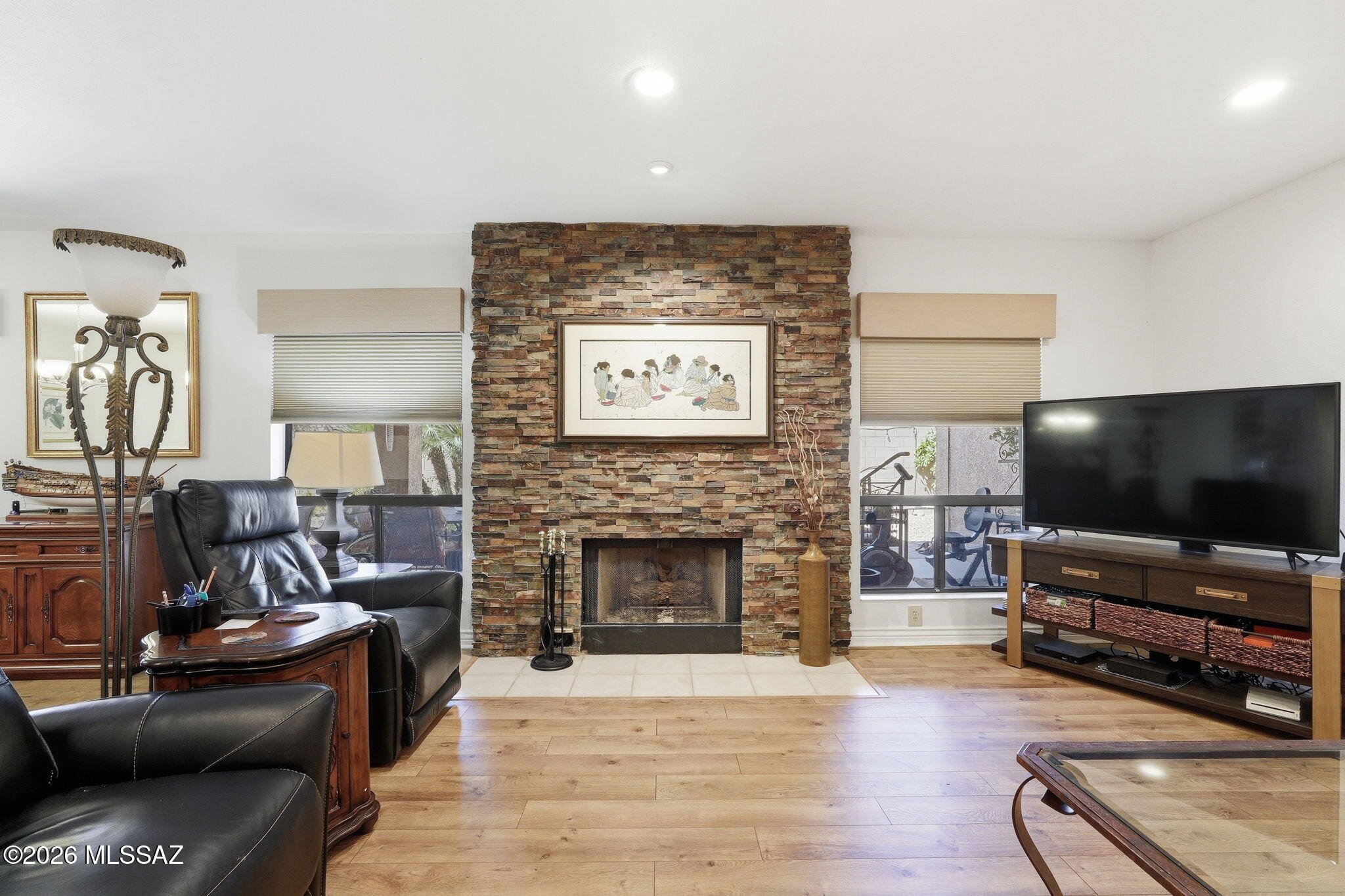 Welcome to this beautifully maintained 3 BD/2BA Alameda model in the highly desirable active-adult community of SaddleBrooke. This inviting home features a bright, open floor plan perfect for everyday living and entertaining. The updated kitchen showcases elegant quartz countertops, complemented by a convenient quartz wet bar ideal for hosting guests. Both bathrooms have been tastefully updated, and the cozy gas fireplace adds warmth and charm to the living space. Additional highlights include ceiling fans in all bedrooms, recirculating water pump, fresh exterior paint (2024), hot tub hookup, and updated irrigation system. Step outside to enjoy the private backyard featuring two citrus trees and a dedicated garden area, creating the perfect setting for relaxing.  Solar screens help with lower electric bills.