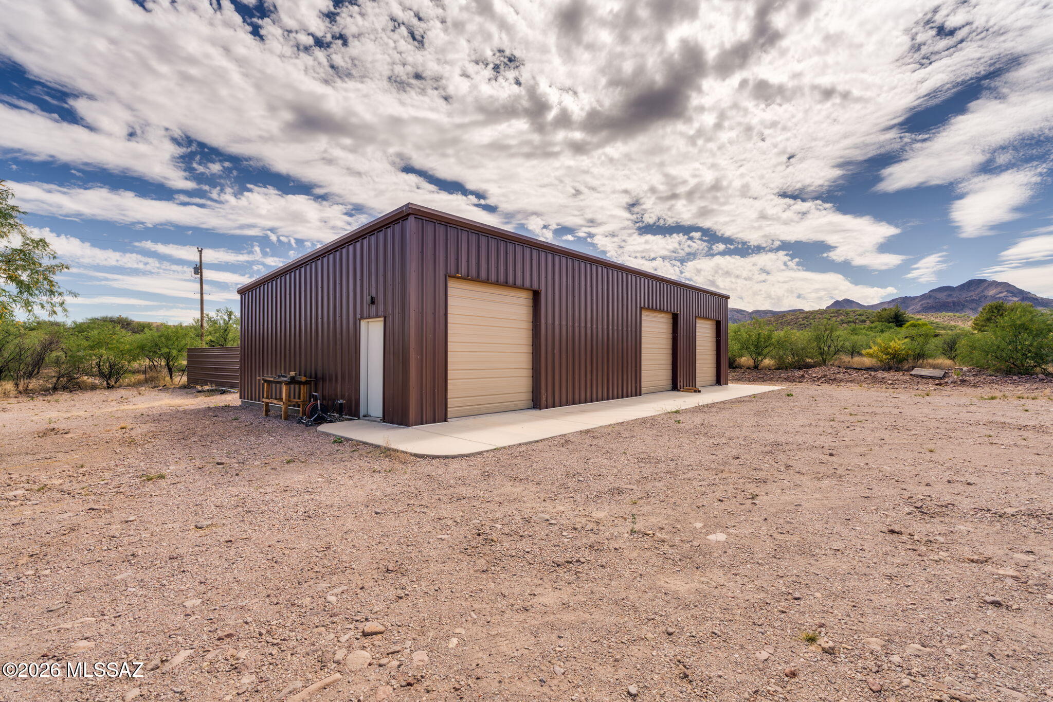 Spacious 30'x69' metal shop situated on 4.63 acres with flexible general rural zoning. The structure features durable 6,000 PSI reinforced concrete slab with #3 rebar on 24-inch centers. 2'' urethane foam insulation and bright LED lighting to simulate natural daylight--ideal for a variety of uses. Plenty of room to build your dream home with panoramic views of the Santa Cruz River Valley and the surrounding mountains & high desert vegetation of mesquite & ocotillo. There is accommodation for an RV. The location is convenient to I-19 just 1 mile away and the Village of Tubac with galleries, restaurants and unique shops is just 2 miles away. This is a versatile property offering functionality, beauty and room to grow.