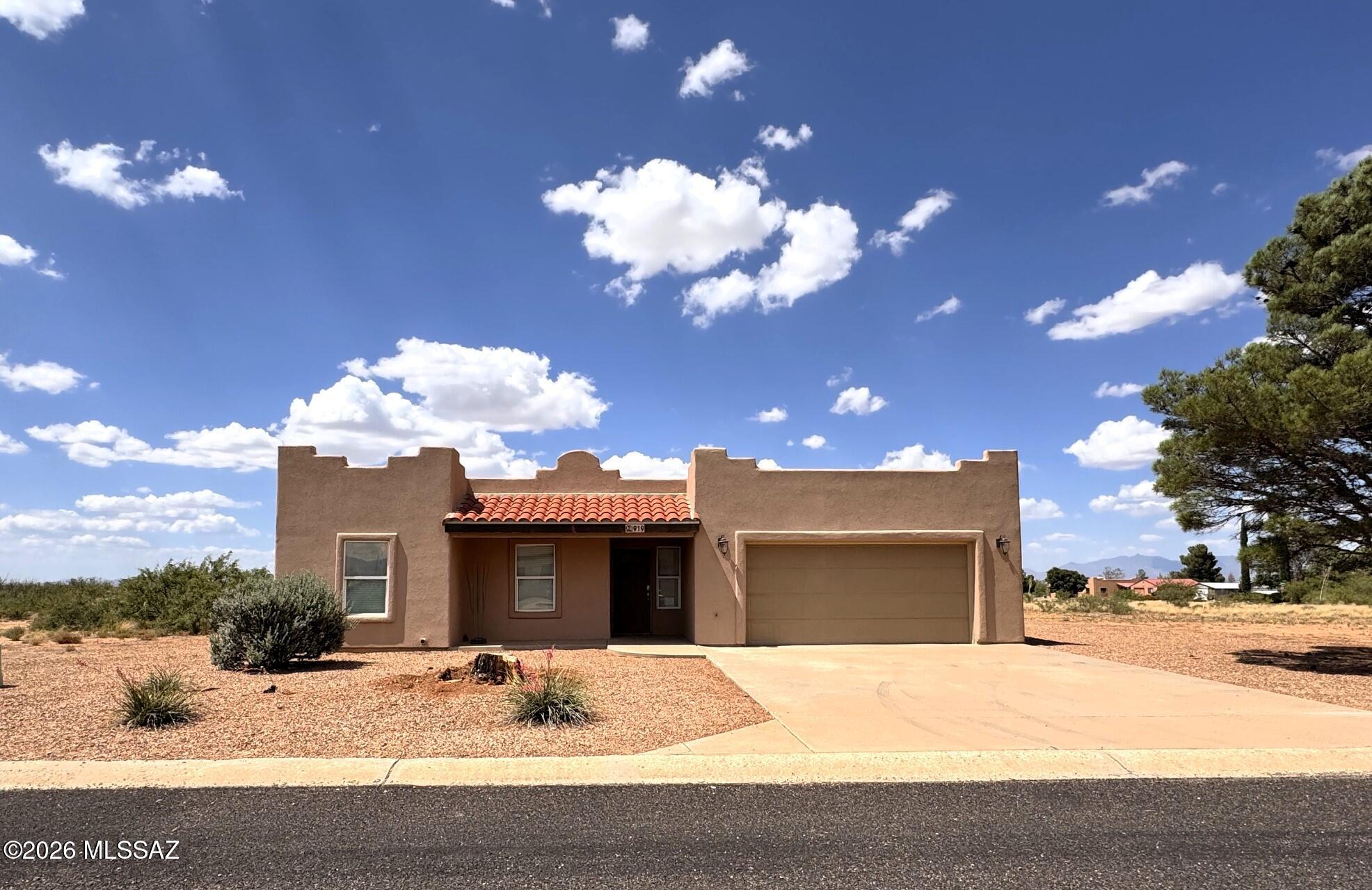 Beautifully maintained Santa Fe-stye home offering exceptional privacy and spetacular views. This move-in-ready property features 3 bedrooms, 2 bathrooms, with tile and wood laminate flooring throughout. The oversized garage includes insulated walls and insulated garage door, along with a full RV hookup.
The home was recently re-stuccoed in 2025, and the sale includes all furnishings, dishes, and utensils, making it truly turnkey. Situated on nearly an acre in a quiet neighborhood, this property offers a rare sense of seclusion with only one neighbor across the street. 
Enjoy breathtaking views, amazing sunsets and sunrises, peaceful desert living, and all the comforts this beautiful property has to offer. Schedule your private showing today!