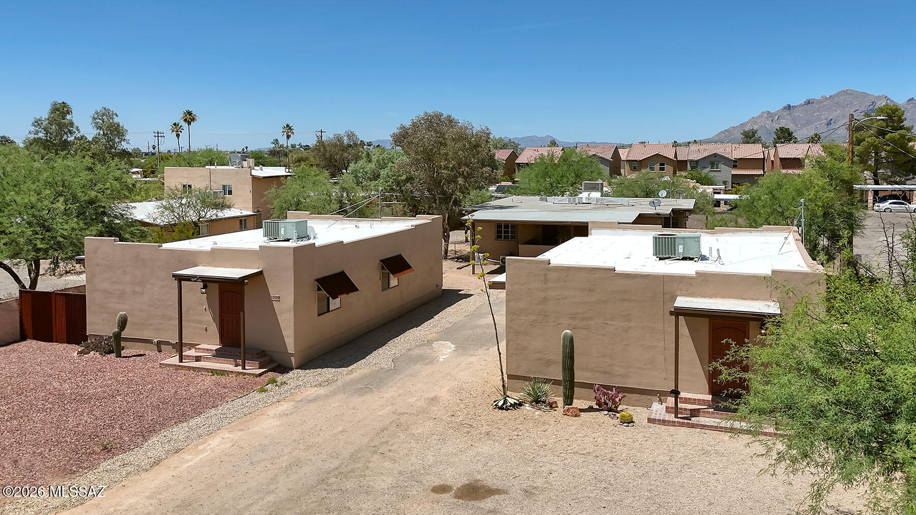 Three Detached buildings-4 Units! 1009, 1011 A/B and 1013 East Halcyon Road! Investor-ready 4-unit multifamily in central Tucson on over 18,000 SF of R-2 zoned land, comprised of three separate tax parcels--offering flexible financing and long-term strategic flexibility. The 4,412 SF property spans three buildings with a desirable unit mix. Two buildings (built 2005) feature 3-bed/2-bath units with scored concrete floors. The rear unit includes a 3-bed/1.5-bath upper unit and a recently remodeled 1-bed/1-bath lower unit. Solid 7% Proforma cap with strong rental demand near the Mountain Ave bike boulevard. Well-positioned for both current income and appreciation.