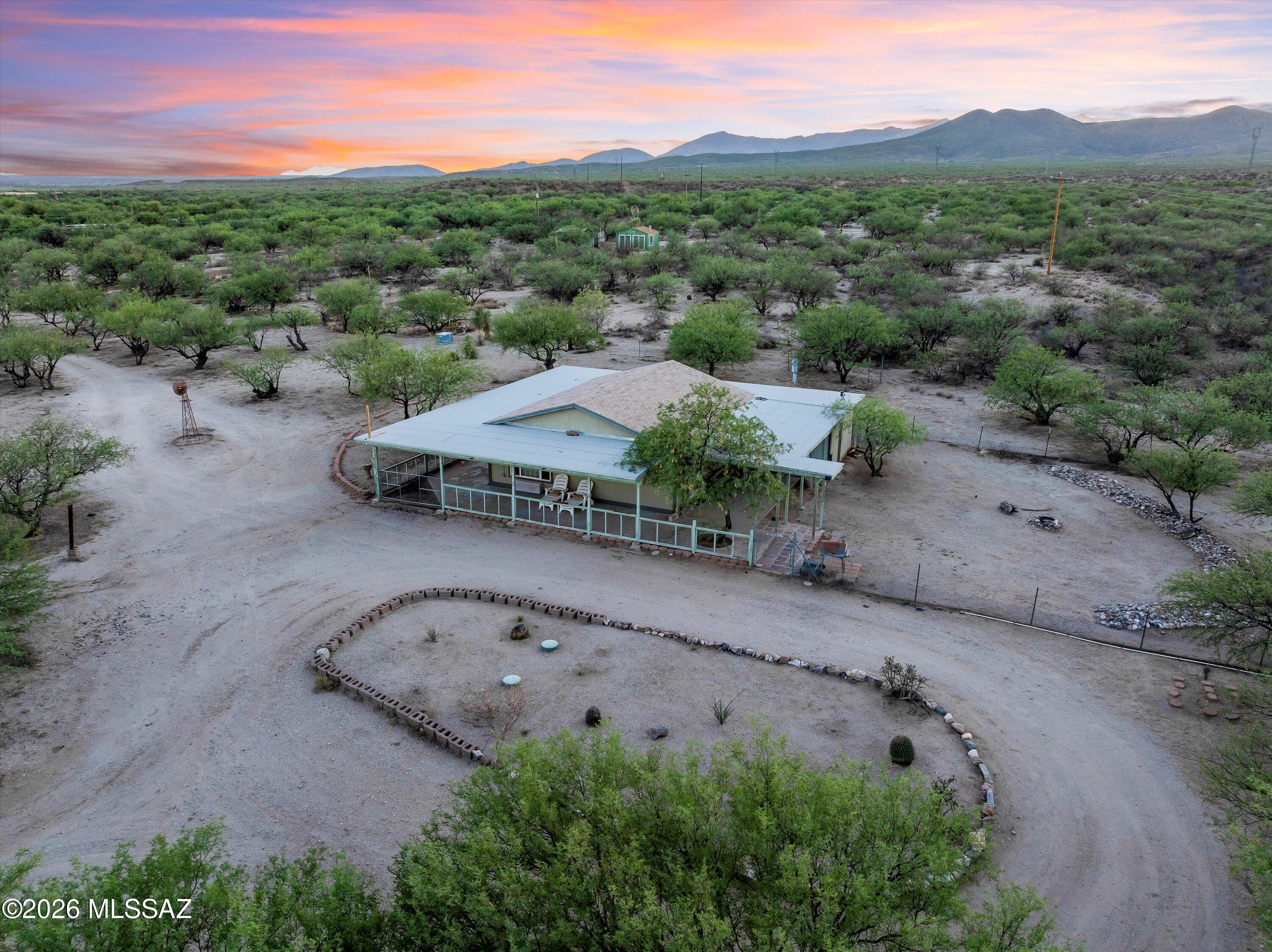Welcome to peaceful desert living on 10 scenic acres with wide-open skies and beautiful mountain views. This warm and inviting 2-bedroom, 1-bath single-family home offers 1,742 square feet of comfortable living space in a quiet, private setting.

Inside, you'll find a bright, functional layout with a spacious kitchen, generous cabinetry, and easy access to the large covered patio—perfect for enjoying morning coffee, evening sunsets, and the gentle desert breeze. The surrounding acreage provides plenty of room for horses, hobby farming, or simply soaking in the tranquility of the desert landscape.

The property includes a private well, a detached shop, and a chicken coop, offering flexibility for animals, projects, or a more self-sufficient lifestyle. With its peaceful surroundings an