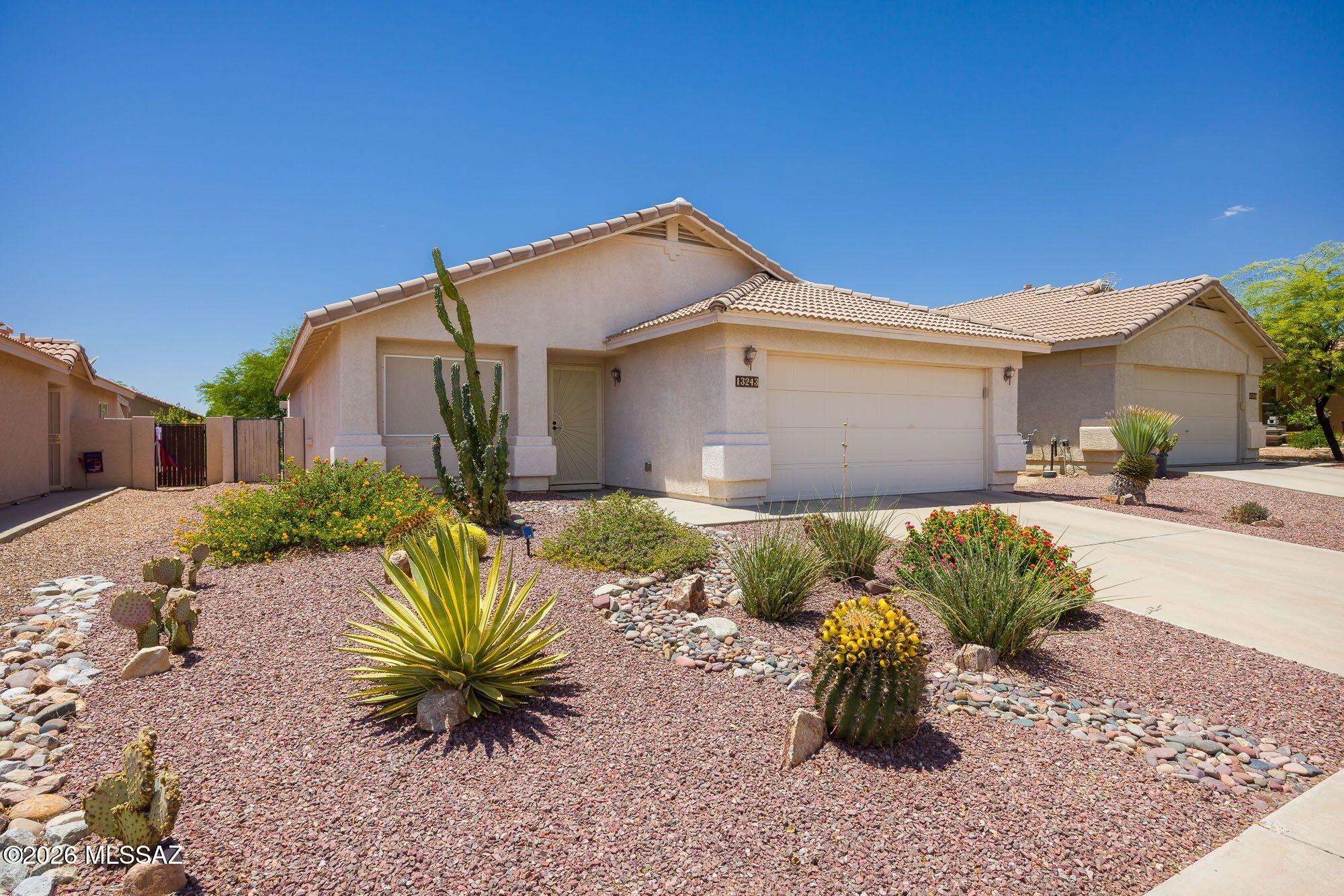 Oro Valley Immaculate 3 bedroom, 2 bathroom home on a beautiful professionally landscaped lot. This is a popular open floor plan with step saver kitchen offering granite counter tops and a pantry. Some upgrades include light fixtures, ceiling fans, and remodeled bathrooms. Owners suite is spacious and has a walk-in closet. All appliances are included in this sale. You will enjoy the covered patio and entertainment area that is paved. Neighborhood offers nearby park and walking trails. This community has excellent schools, shopping, and restaurants.