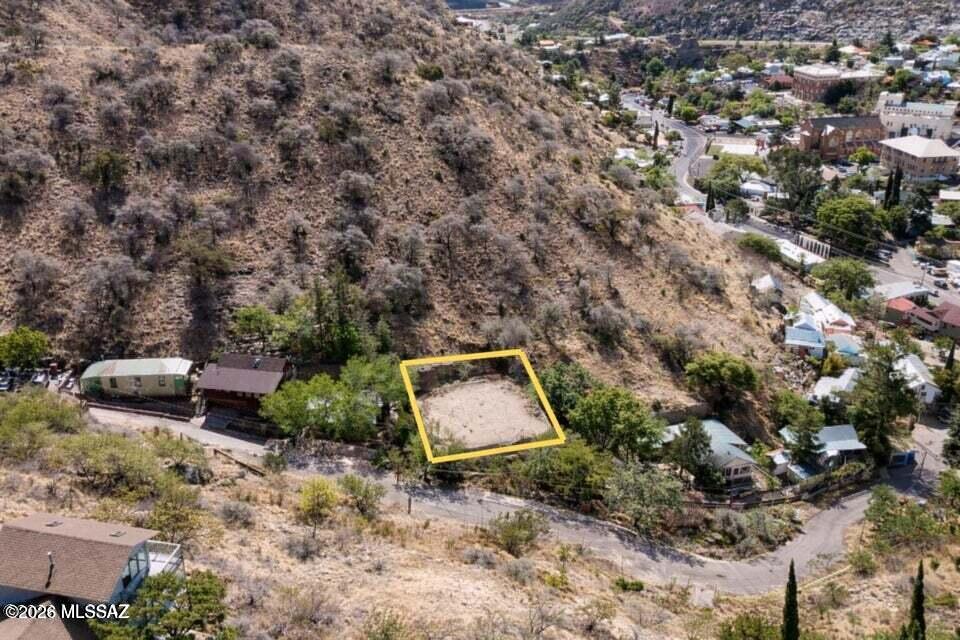 Rare opportunity to own a buildable residential lot in historic Bisbee. Located just off Tombstone Canyon Rd, 34 Art Ave offers paved access with water on-site and utilities at or near the lot line, reducing development costs. This 0.11-acre hillside parcel features city and mountain views in a quiet setting, just minutes from downtown shops, restaurants, and galleries. No HOA or deed restrictions (buyer to verify), making it ideal for a custom home, second home, or investment. Strong location with long-term upside in one of Southern Arizona's most unique markets.
