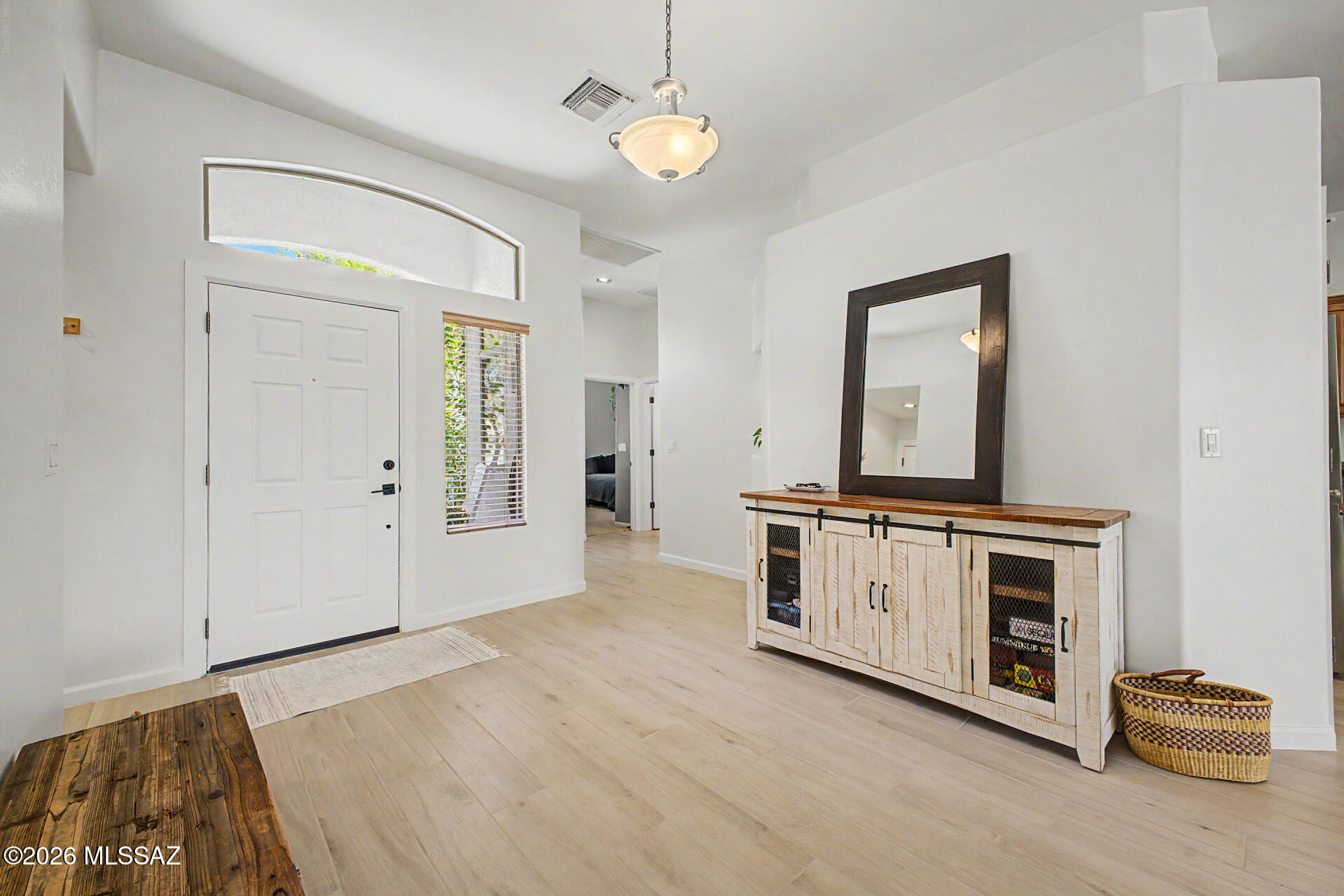 ✨ Sunlit Serenity in Gladden Farms ✨

Step into a home where the world slows down the moment you walk through the door. Filled with natural light, vaulted ceilings, and beautiful flooring, this thoughtfully designed split floor plan offers both privacy and connection. The open-concept living spaces flow effortlessly into a spacious kitchen with generous counter space and breakfast bar perfect for gathering. Retreat to the peaceful primary suite featuring dual walk-in closets, dual vanities, a garden tub, and spa-like feel. Outside, enjoy your own backyard escape with no back neighbors, lush grass, mature trees, pavers, and an extended covered patio perfect for quiet mornings or relaxing Arizona evenings.
