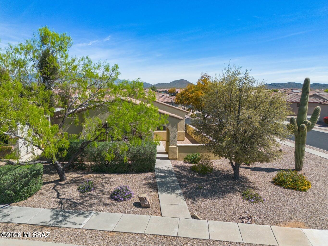 Welcome to easy living in the sought-after Del Webb at Rancho del Lago community in Vail, Arizona! Perfectly situated on a spacious corner lot with convenient guest parking nearby, this
beautifully maintained home offers the ideal blend of comfort, convenience, and active
adult living. Featuring a desirable split-bedroom floor plan, the residence includes two
bedrooms, two bathrooms, and a versatile office/den that can easily serve as a bonus
room, hobby space, or home office. From the moment you enter, you'll appreciate the abundance of natural light and the
home's bright, inviting atmosphere. A calming color palette creates a fresh and welcoming
environment, ready to complement any décor style. The kitchen is both functional and
attractive, featuring Corian countertops and white appliances that provide a clean, seamless, and timeless look. A spacious two-car garage adds convenience and ample
storage. Enjoy peaceful mornings relaxing in your private courtyard or strolling through the beautifully maintained neighborhood. Whether you're a seasonal visitor seeking a winter retreat or a full-time resident embracing Arizona's sunshine, this home offers the lifestyle you've been dreaming of. Residents of Del Webb at Rancho del Lago enjoy an exceptional array of resort-style amenities and activities, including pickleball, golf, swimming, crafts, social clubs, and a vibrant clubhouse. Additional community features include walking and biking trails, an outdoor amphitheater, fitness center, aerobics and dance studio, outdoor pool, hobby and game rooms, racquetball courts, and multipurpose gathering spaces designed to support an active and engaging lifestyle. Conveniently located just minutes from parks, shopping, dining, and everyday
conveniences, while surrounded by beautifully landscaped common areas maintained by the HOA, this home truly delivers the best of Arizona living. If the Tucson sunshine doesn't win you over, the exceptional lifestyle offered by this premier 55+ community certainly will.