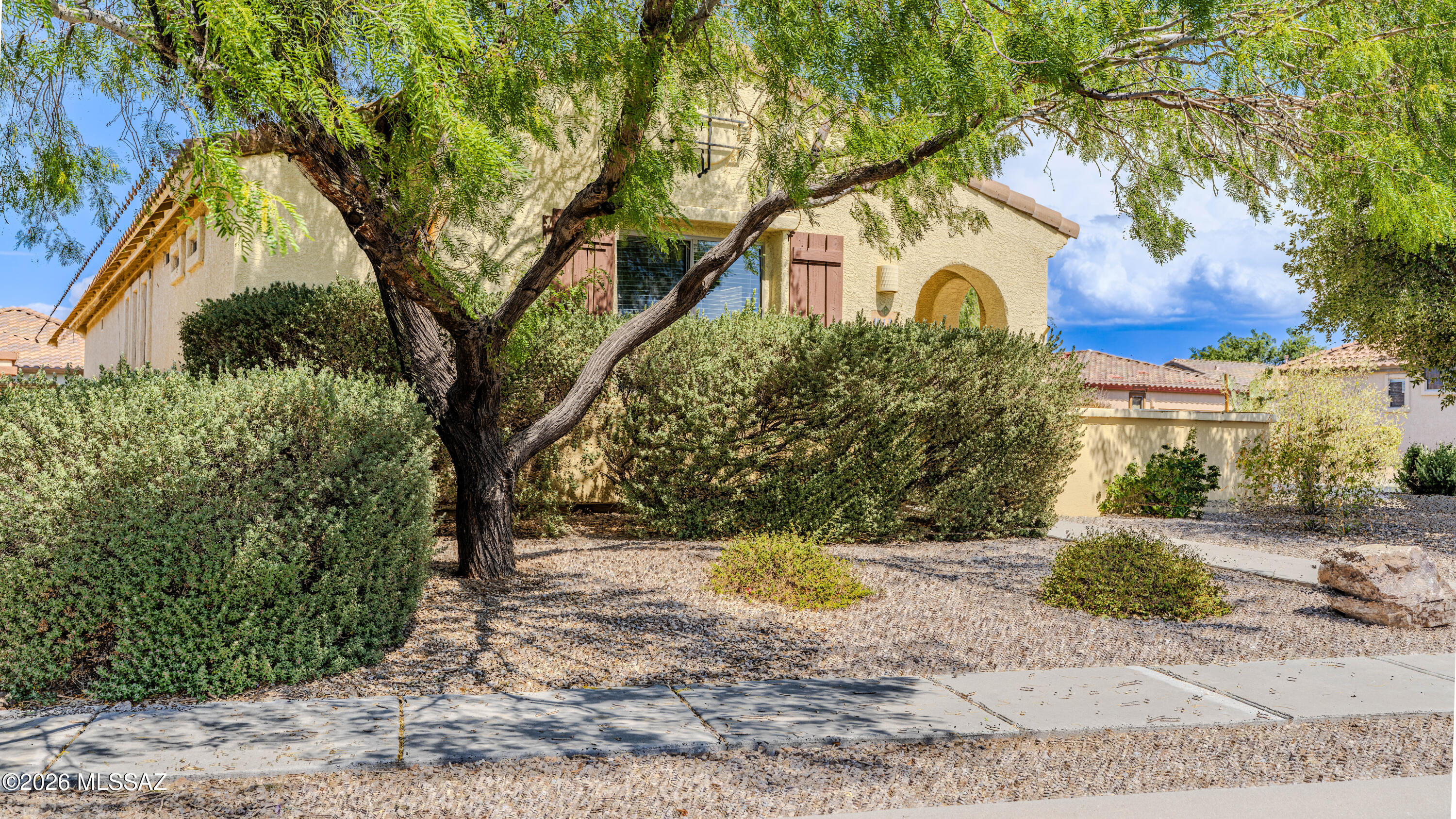 Welcome to easy living in the sought-after Del Webb at Rancho del Lago community in Vail, Arizona! Perfectly situated on a spacious corner lot with convenient guest parking nearby, this
beautifully maintained home offers the ideal blend of comfort, convenience, and active
adult living. Featuring a desirable split-bedroom floor plan, the residence includes two
bedrooms, two bathrooms, and a versatile office/den that can easily serve as a bonus
room, hobby space, or home office. From the moment you enter, you'll appreciate the abundance of natural light and the
home's bright, inviting atmosphere. A calming color palette creates a fresh and welcoming
environment, ready to complement any décor style. The kitchen is both functional and
attractive, featuring Corian countertops and white appliances that provide a clean, seamless, and timeless look. A spacious two-car garage adds convenience and ample
storage. Enjoy peaceful mornings relaxing in your private courtyard or strolling through the beautifully maintained neighborhood. Whether you're a seasonal visitor seeking a winter retreat or a full-time resident embracing Arizona's sunshine, this home offers the lifestyle you've been dreaming of. Residents of Del Webb at Rancho del Lago enjoy an exceptional array of resort-style amenities and activities, including pickleball, golf, swimming, crafts, social clubs, and a vibrant clubhouse. Additional community features include walking and biking trails, an outdoor amphitheater, fitness center, aerobics and dance studio, outdoor pool, hobby and game rooms, racquetball courts, and multipurpose gathering spaces designed to support an active and engaging lifestyle. Conveniently located just minutes from parks, shopping, dining, and everyday
conveniences, while surrounded by beautifully landscaped common areas maintained by the HOA, this home truly delivers the best of Arizona living. If the Tucson sunshine doesn't win you over, the exceptional lifestyle offered by this premier 55+ community certainly will.