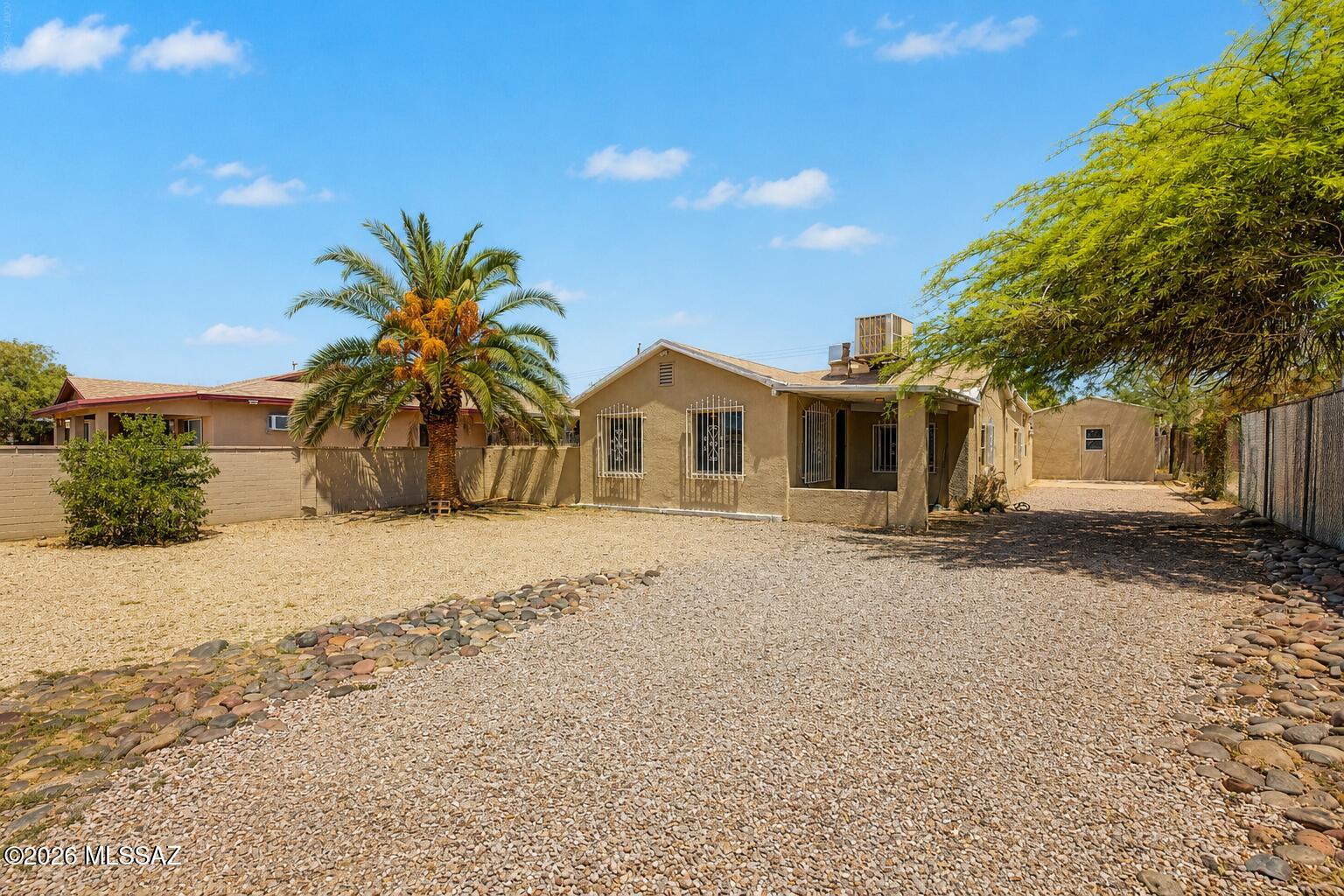 Welcome to this charming South Tucson home, offering the perfect opportunity to make it your own. Full of character and potential, this property is ready for your personal style and vision. One of its standout features is the detached storage building, which was previously approved as an ADU and now serves as storage. Whether you envision a future guest house, home office, art studio, workout space, or private retreat, the possibilities are exciting (buyer to verify current permitting requirements and intended use). The generous lot provides plenty of room to enjoy the outdoors, entertain, garden, or simply create the space you've always wanted. Conveniently located near shopping, dining, schools, and everyday amenities, this home offers a wonderful balance of comfort today and opportunity for tomorrow. If you've been searching for a property with charm, flexibility, and room to grow, this is one you won't want to miss.