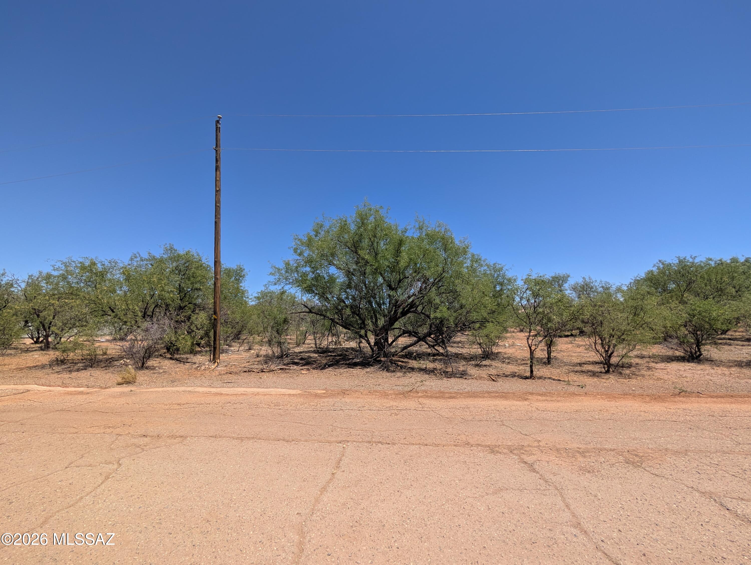 This flat lot with mountain views is ready for development. Paved roads and utilities at the street: electric, water and sewer. No water tap needed. Just minutes from dining, shopping and schools. Buyer to verify all information deemed important to Buyer.