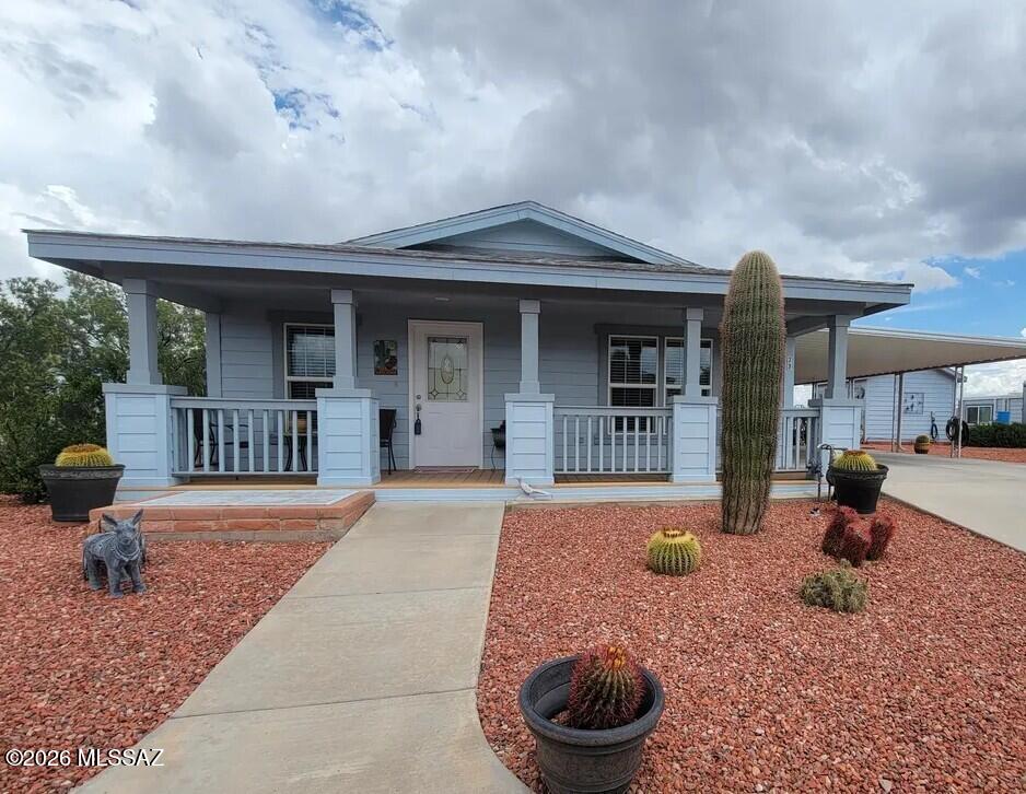 Charming 2 bed 2 bath well-maintained home in the gated community Eagles Landing at CTRV. The open floor plan offers comfortable living space, a functional kitchen, and a private patio perfect for enjoying Southern Arizona's sunshine. Offered fully furnished, this home is move in ready with plenty of storage inside and out. Storage shed and double length carport provide extra space for vehicles and toys.