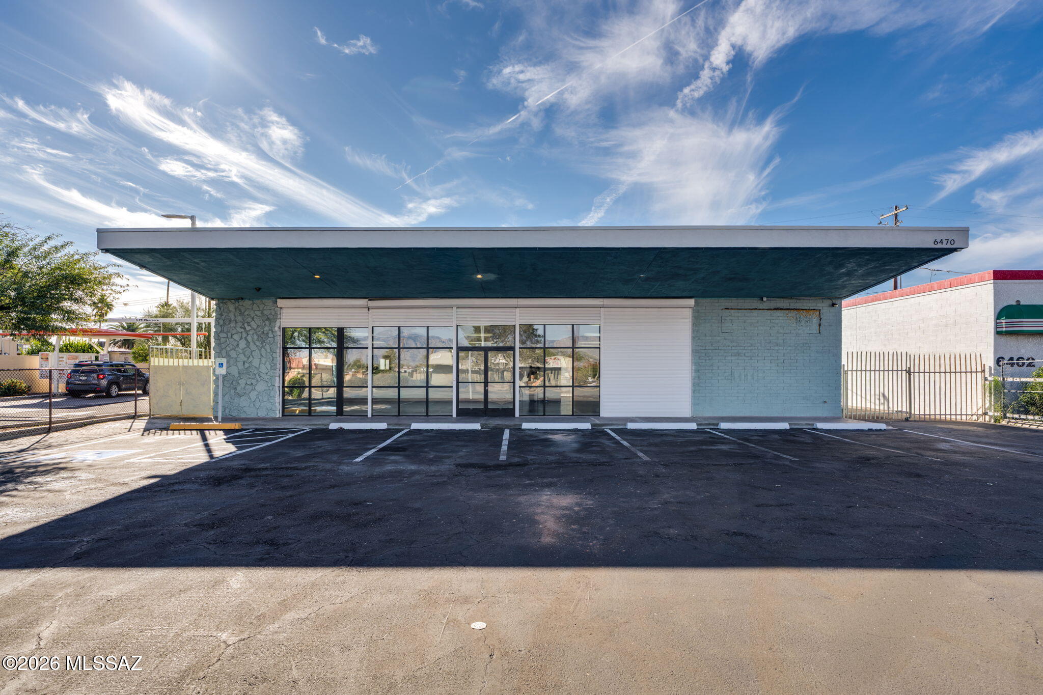 Fully renovated and move-in ready, this 2,600 SF commercial building offers versatile C-1 zoning, ideal for professional, retail, and service-based businesses. Featuring ADA-compliant access, the property provides convenience and accessibility for clients, customers, patients, and employees. Modern finishes throughout create a professional, welcoming environment while minimizing startup costs and downtime. Additional highlights include private on-site parking, a fully fenced rear yard for secure storage or operational flexibility, and beautiful mountain views. Located in a desirable East Side location with excellent access, visibility, and exposure, this turnkey property is an outstanding opportunity for an owner-user, expanding business, or investor