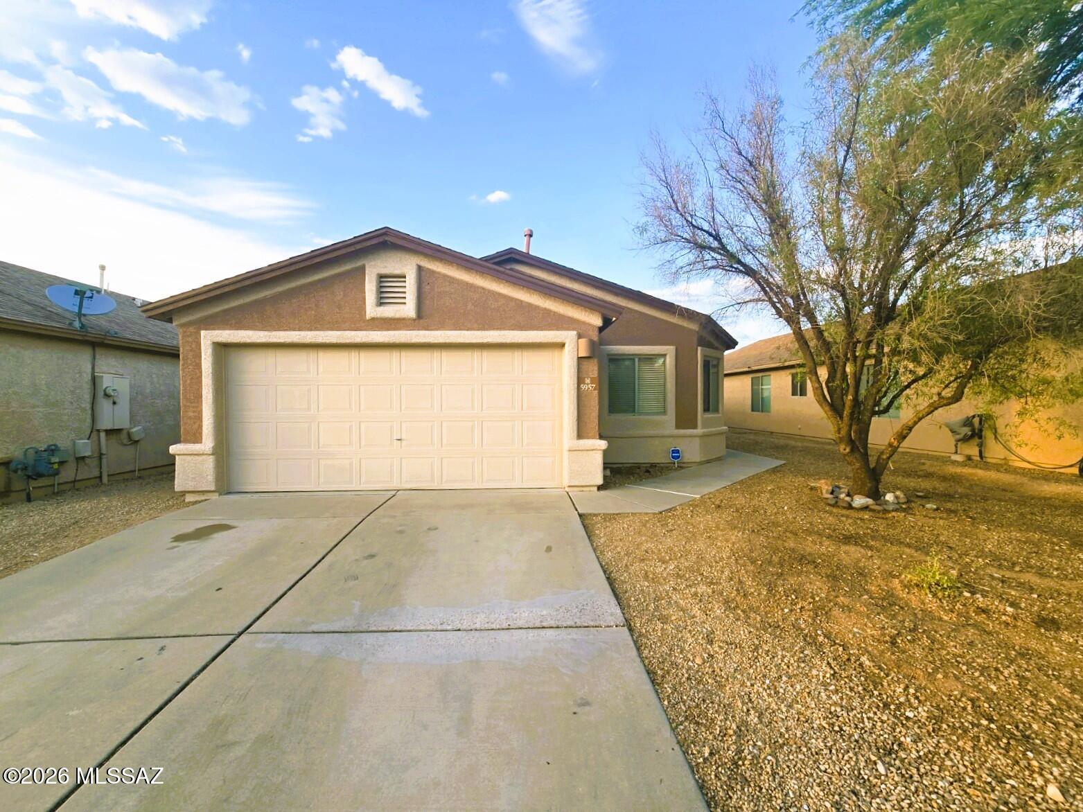 Welcome Home to this spacious beauty in the highly desirable, hidden gem community of Canterbury Ranch! This ample 4 bed/2 full bath home offers vaulted ceilings, upgraded faux wood LVP flooring(2024) with extra padding in dining area, great room, & hall, freshly painted exterior(June 2026), & includes ALL appliances! Home is whole-house piped for water softener, includes Reverse Osmosis water filter system, Newer HVAC (2025) & Bedroom carpets professionally cleaned (June 2026)! Enjoy your family gatherings & privacy in the backyard ready with string lights, no rear-neighbors & large covered patio. 2 play areas in neighborhood! Bonus views of the annual Airshow, near Davis Monthan, quick freeway access, & just minutes from Tucson Marketplace! Check it out for yourself & make an offer!
