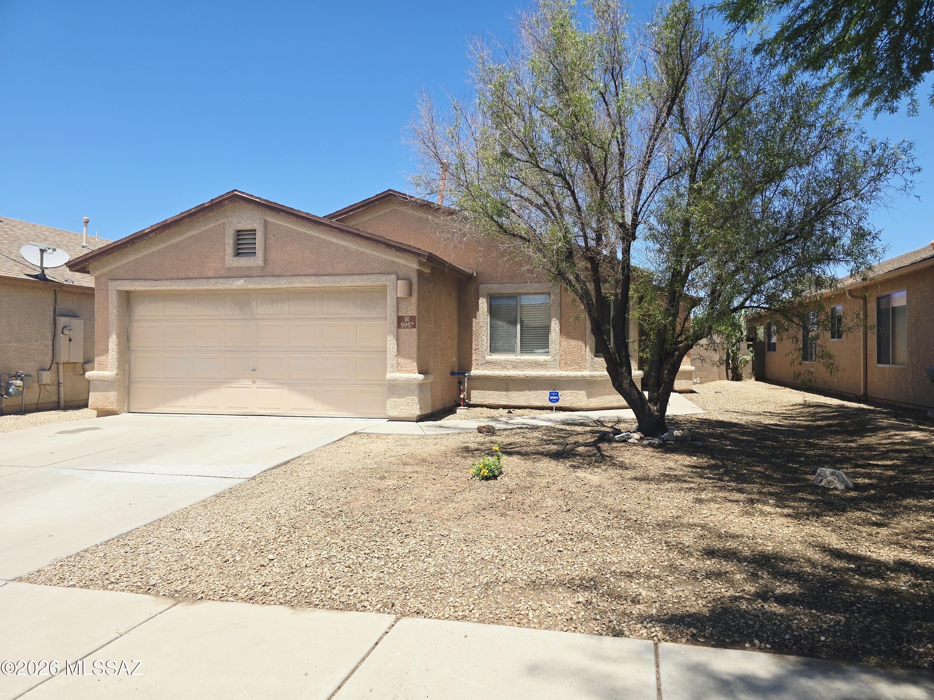 Welcome Home to this spacious beauty in the highly desirable, hidden gem community of Canterbury Ranch! This ample 4 bed/2 full bath home offers vaulted ceilings, upgraded faux wood LVP flooring(2024) with extra padding in dining area, great room, & hall, freshly painted exterior(June 2026), & includes ALL appliances! Home is whole-house piped for water softener, includes Reverse Osmosis water filter system, Newer HVAC (2025) & Bedroom carpets professionally cleaned (June 2026)! Enjoy your family gatherings & privacy in the backyard ready with string lights, no rear-neighbors & large covered patio. 2 play areas in neighborhood! Bonus views of the annual Airshow, near Davis Monthan, quick freeway access, & just minutes from Tucson Marketplace! Check it out for yourself & make an offer!