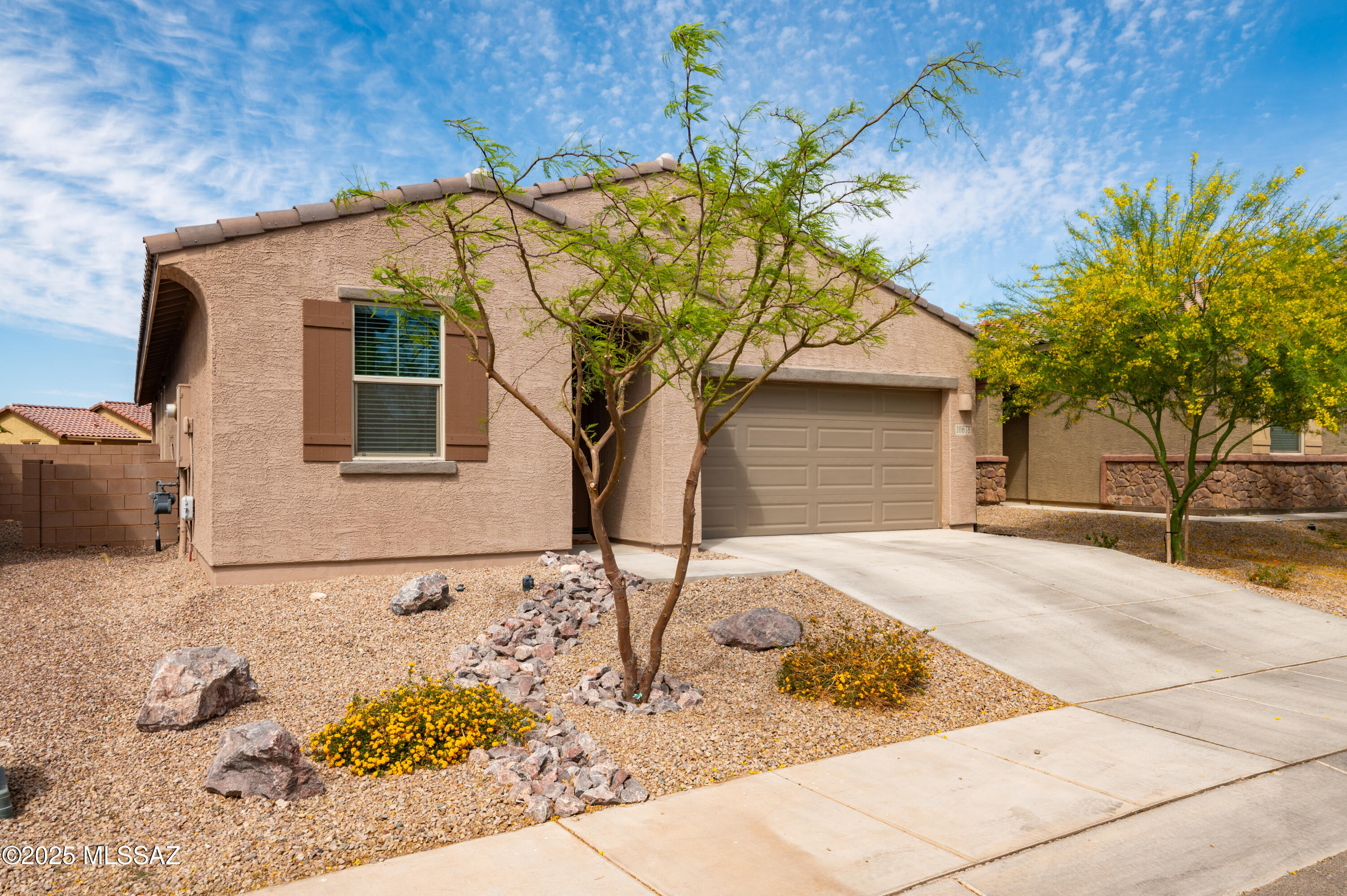 PRICED $20,000 UNDER WHAT SELLER PAID NEW! Might look the same as the others from the outside but wait until you see what the sellers did inside! Custom touches make this 2022 build, single story, 4-bedroom 3 bath, great room floor plan stand out.  Ceramic tile, quartz countertops, 42-inch cabinets, separate laundry room, blinds throughout. Custom paneling in all of the right places. Check out the special area for your favorite pet! Plus completed backyard with pavers and turf. Energy efficient Gladden Farms is booming with new businesses! Don't wait for a new build with a dirt backyard that you have to make your own. This home is waiting for you!