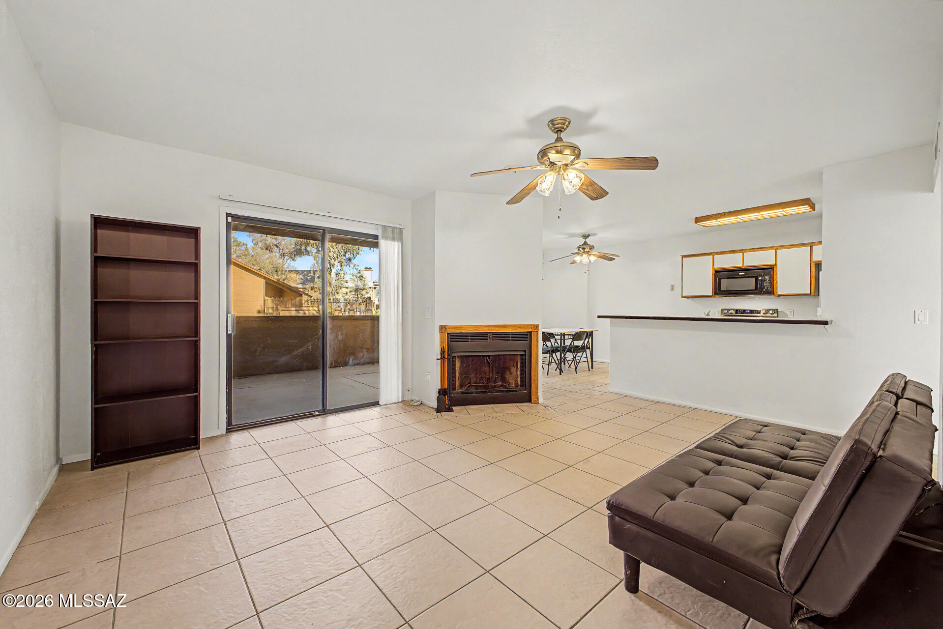 Seize the chance to own this ground-level 2-bedroom, 2-bath apartment unit! Inside, you'll find a serene living room with a soothing palette, durable tile flooring, and an inviting fireplace for relaxing evenings with loved ones. The eat-in kitchen comes with ample cabinetry, essential built-in appliances, and a two-tier peninsula with a breakfast bar for casual meals. The primary bedroom showcases soft carpeting, a private bathroom, and a convenient walk-in closet. Unwind at the end of a long day on the covered patio, perfect for enjoying a good book or a refreshing drink. The Community boasts a refreshing pool, lush green spaces, and well-maintained common areas. Don't miss out on this fantastic opportunity!