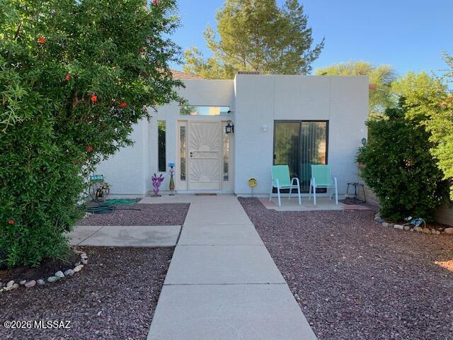 Discover this turnkey townhome in a lovely, gated community that includes a refreshing pool, clubhouse, and basketball court as part of the HOA. The inviting great room, complete with a cozy fireplace, opens to a private patio featuring low-maintenance artificial turf and lush fruit trees, perfect for relaxing evenings. This home boasts a split-bedroom layout, a walk-in closet, an ensuite primary bathroom, and a convenient laundry room. Enjoy the benefits of a new roof, a newer AC, and beautiful ceramic flooring. Conveniently located near schools, supermarkets, and restaurants, and just moments away from the scenic San Cayetano Mountains, this home is a must-see!