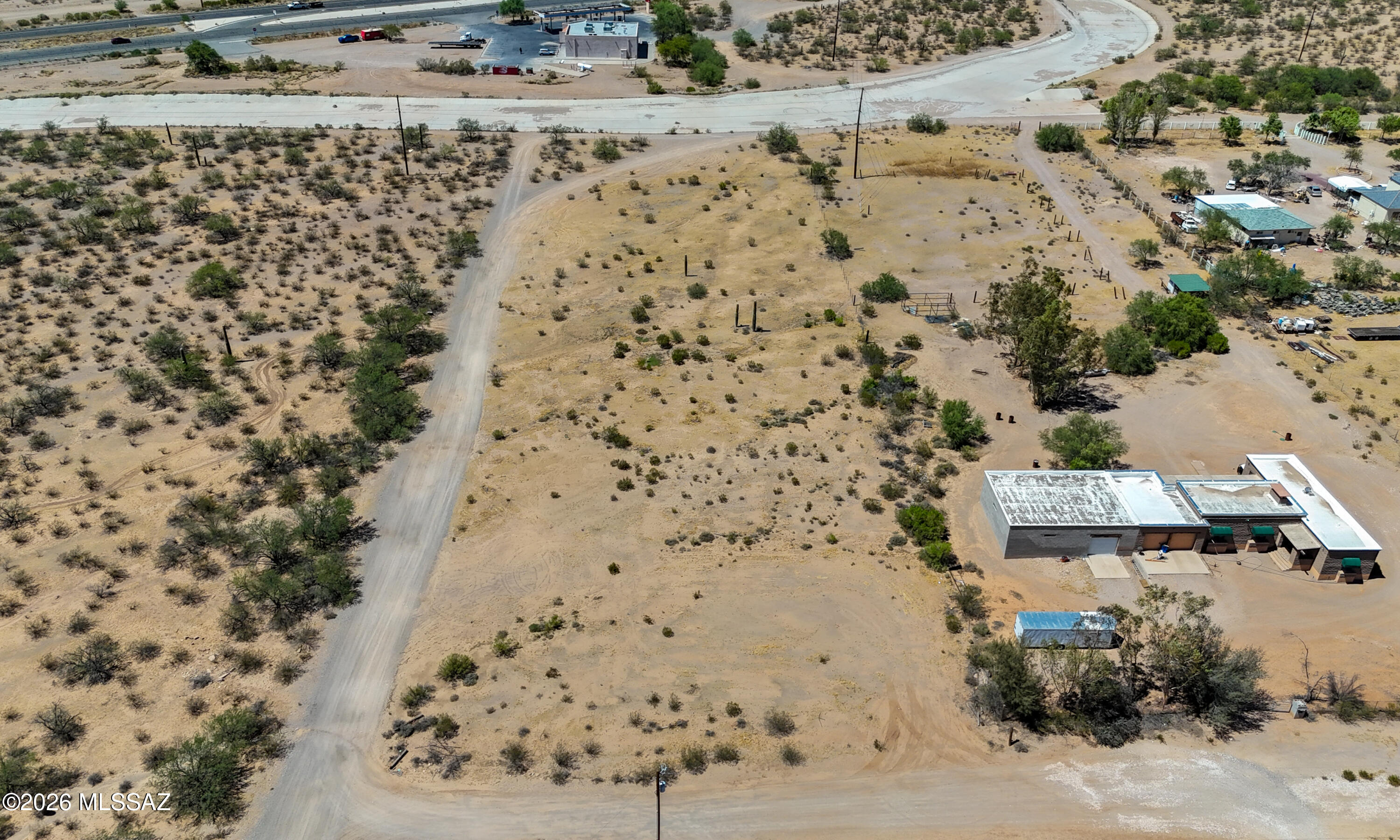 Build your dream home on this exceptional 2.92-acre corner lot, ideally located just south of Ajo Highway and east of Camino Verde. This expansive, flat parcel offers endless possibilities and is surrounded by beautiful custom homes, creating the perfect setting for your future residence. The property features electric service, access to a shared well, and partial fencing, providing added convenience and value. Enjoy breathtaking mountain views, wide-open skies, and the peaceful atmosphere of country living while remaining just a short drive from city amenities. Don't miss this rare opportunity to own a premium homesite in a highly desirable area!