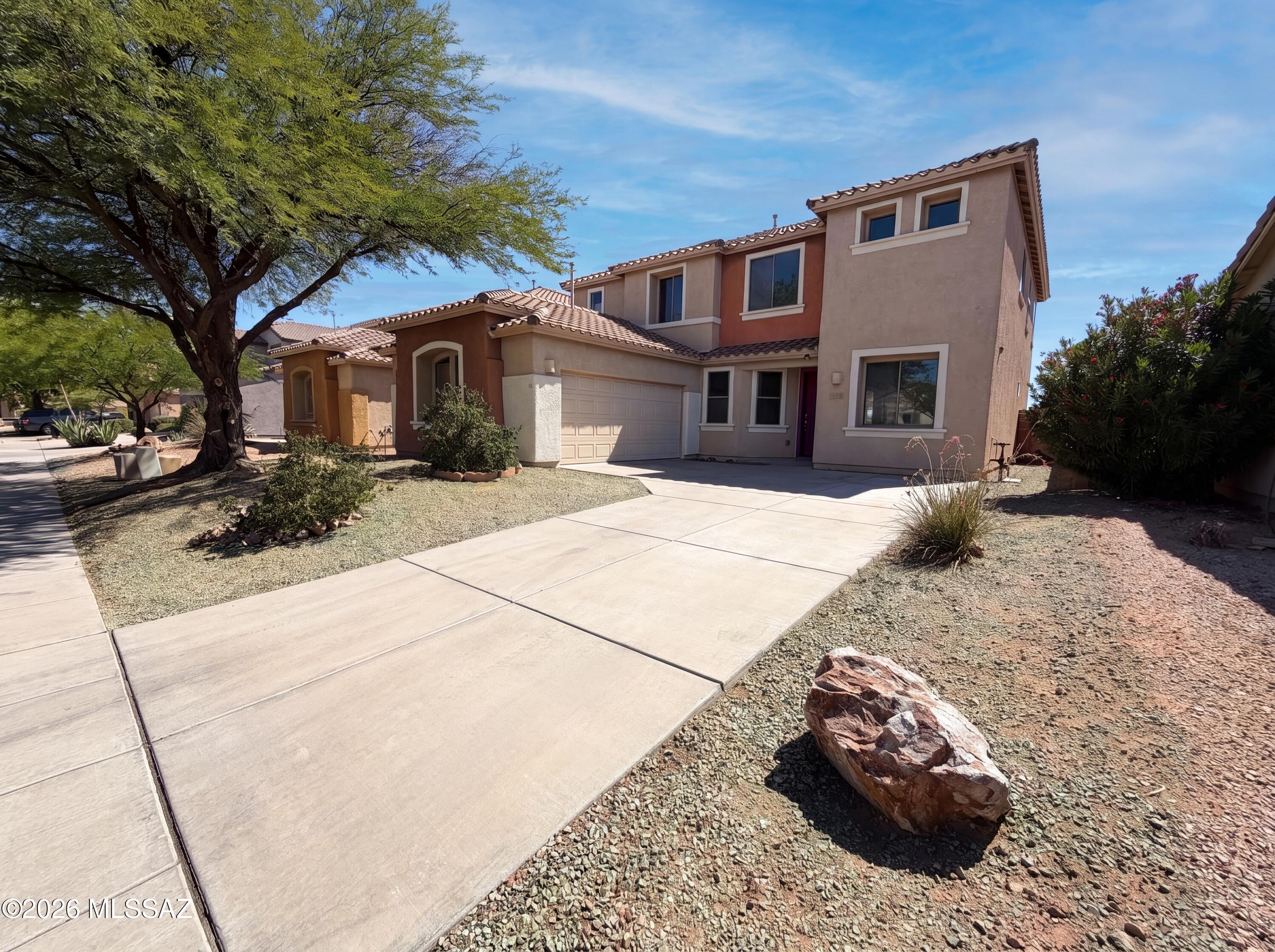 Welcome to 7143 S Valley Stream Dr! Step outside to a welcoming patio, ideal for outdoor dining and relaxation. The kitchen features stainless steel appliances and a convenient island for extra prep space. Fresh interior paint gives the home a clean, updated feel, while partial flooring replacement adds a modern touch throughout. Low-maintenance landscaping keeps the exterior looking great year-round. A stylish blend of comfort and functionality awaits.. Included 100-Day Home Warranty with buyer activation
