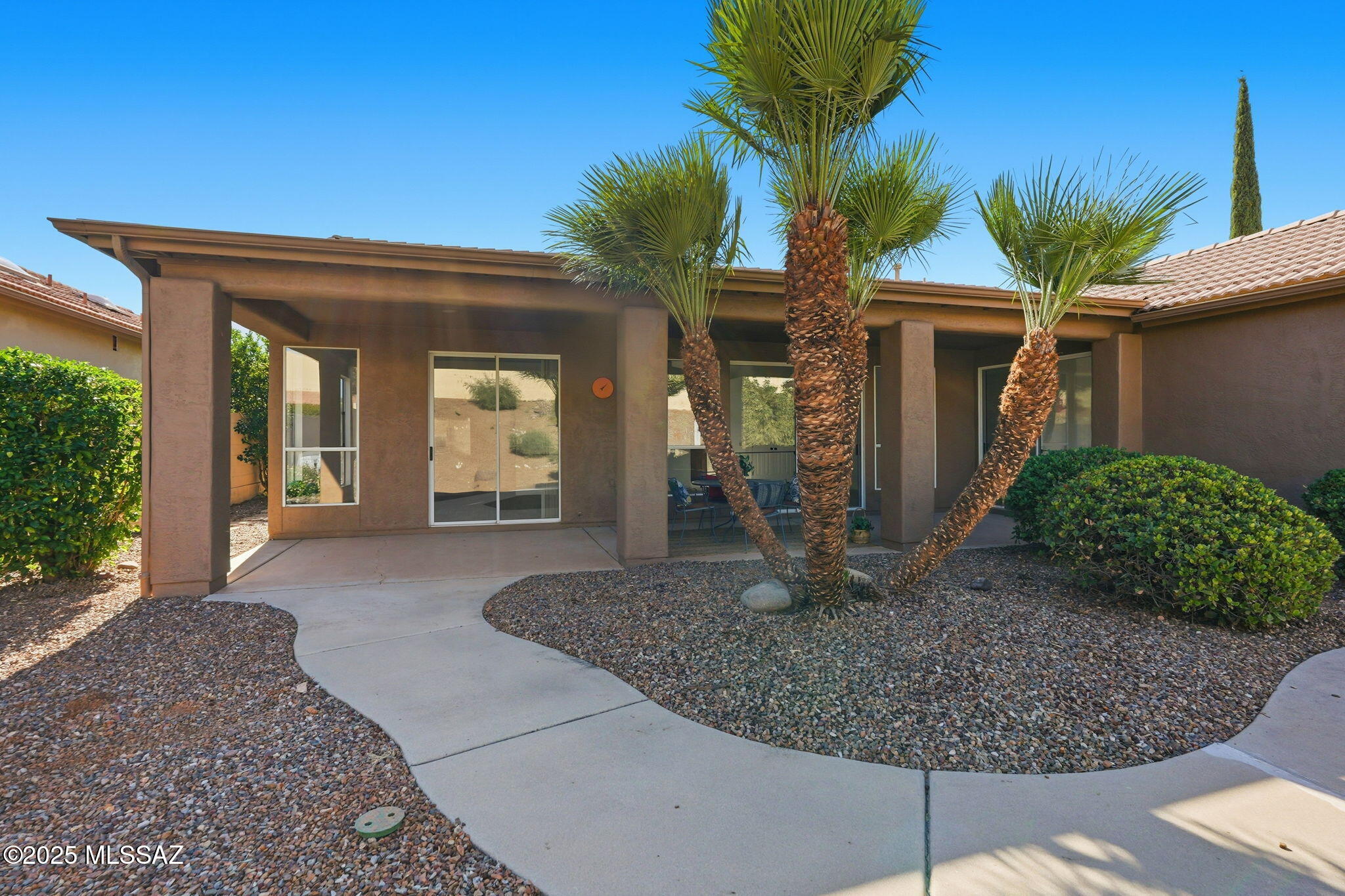 Completely updated Paloma floorplan! This 2-bed + den, 2.5-bath beauty offers soaring ceilings, big picture windows, and an open living area with wet bar. NEW interior/exterior paint, tile flooring, appliances, HVAC, water heater, countertops, fixtures & more—just move right in! Split en-suite bedrooms provide privacy. Enjoy views from the expansive covered patio and frontyard. Access to BOTH HOA 1 & 2 amenities: golf, tennis, pickleball, pools, clubhouses & more. The BEST home around—showing like new!