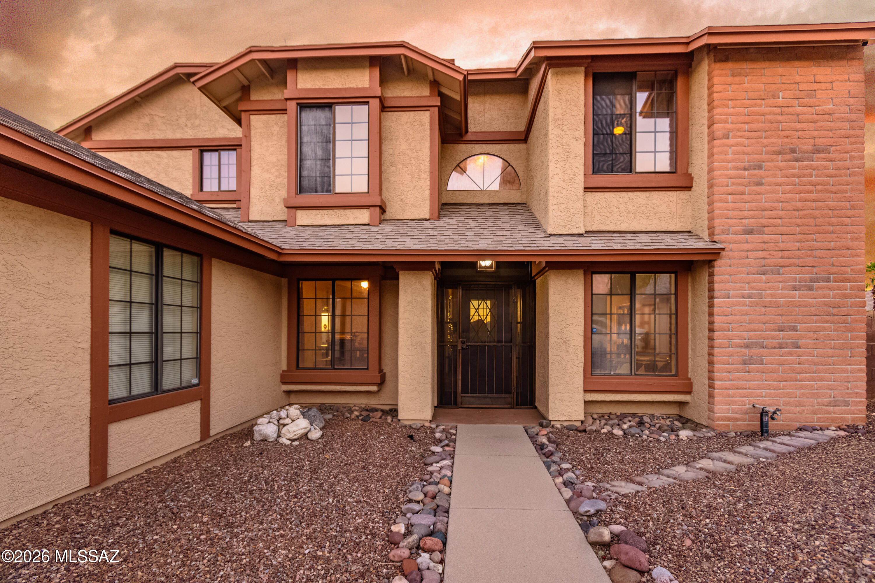 Home is perfectly positioned to capture breathtaking AZ sunsets!
Spend evenings in the sparkling pool & spa, gather round the fire pit beneath the stars or relax under the covered patio while enjoying the peaceful backdrop & mountain views.
Inside, soaring ceilings & abundant natural light create an inviting atmosphere. The thoughtfully designed floor plan offers multiple living spaces, a downstairs bed & full bath ideal for guests or multigen living & a spacious loft perfect for a home office/media room/play area.
Kitchen features stainless steel appliances, generous cabinetry, ample counter space, & overlooks the family room, making entertaining effortless
Retreat to the primary suite featuring dual vanities, a relaxing garden tub, separate shower, walk-in closet.
This home has it a
