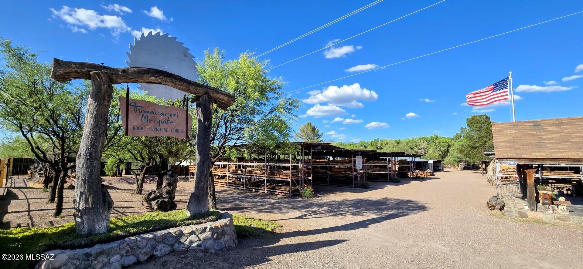Incredible opportunity to purchase a property that includes a ''Turnkey'' business established 40 years ago with an outstanding reputation. The Tumacácori Mesquite Sawmill is along the I-19 E. Frontage Rd with excellent traffic visibility and boasts thousands of visitors annually. It's situated near the Santa Cruz River with a large a cottonwood belt and surrounded by incredible mountain ranges to the East & West. It is in a Historical and Art community within the Tubac Valley. The area is a strong destination for tourism and shoppers. Tumacácori Mesquite Sawmill is Arizona's oldest mesquite source and provides opportunity for growth, profitability, and a wonderful lifestyle. A full list of inventory, equipment and other assets is available to a qualified interested prospect. A must see! The property is well manicured and maintained containing a LT-40 HD Woodmizer Sawmill that produces quality lumber products and covered wood dying racks provide appropriate protection from the elements. An incredible mesquite inventory, different work areas with equipment, a retail shop and office, a housed large laser etcher, wood drying room, storage rooms, carports, breakroom, water well housing and much more. It also has a beautiful wood structured home on the property that can be a residence or a secondary showroom. A large adjacent parcel is included in this offering that can be used to generate additional income. The Tumacácori Mesquite Sawmill is known for responsibly harvesting the rare Sonoran Desert Velvet Mesquite and transforming this unique treasure into lumber, crafts, and stunning one-of-a-kind wood products.